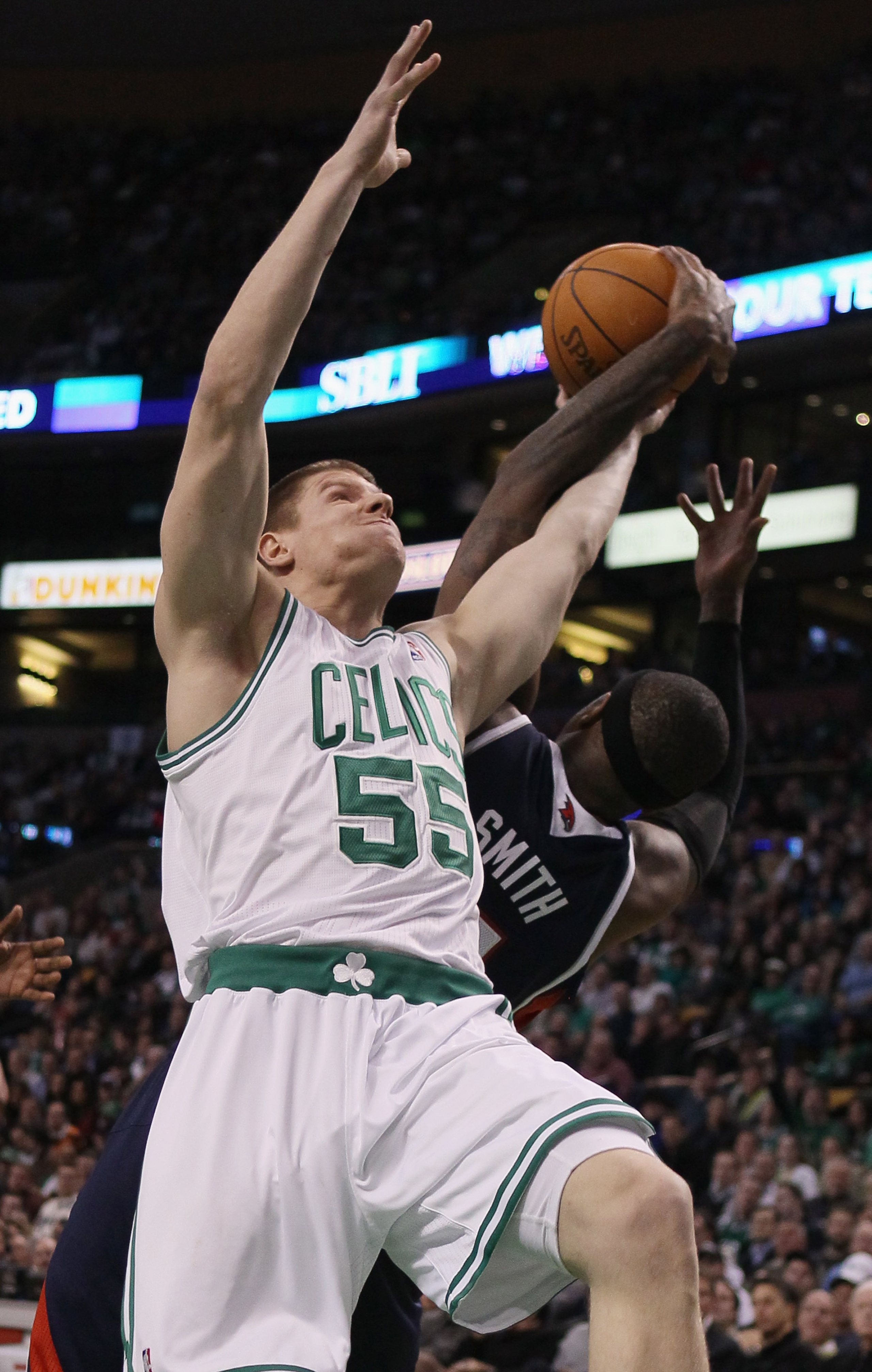 BOSTON, MA - DECEMBER 16:  Luke Harangody #55 of the Boston Celtics and Josh Smith #5 of the Atlanta Hawks fight for the ball in the first half on December 16, 2010 at the TD Garden in Boston, Massachusetts. NOTE TO USER: User expressly acknowledges and a