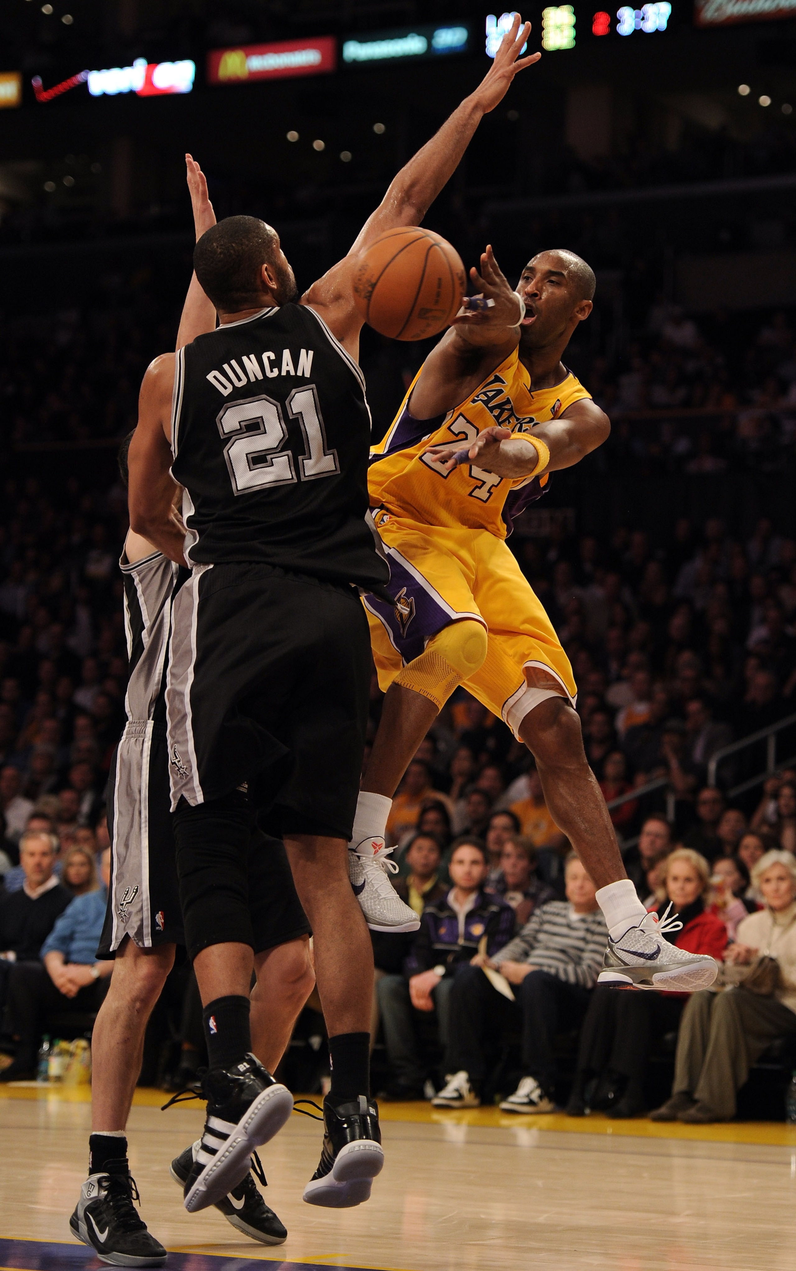 LOS ANGELES, CA - FEBRUARY 03: Kobe Bryant #24 of the Los Angeles Lakers passes around Tim Duncan #21 of the San Antonio Spurs during the first half at Staples Center on February 3, 2011 in Los Angeles, California. NOTE TO USER: User expressly acknowled LOS ANGELES, CA - FEBRUARY 03: Kobe Bryant #24 of the Los Angeles Lakers passes around Tim Duncan #21 of the San Antonio Spurs during the first half at Staples Center on February 3, 2011 in Los Angeles, California. NOTE TO USER: User expressly acknowled