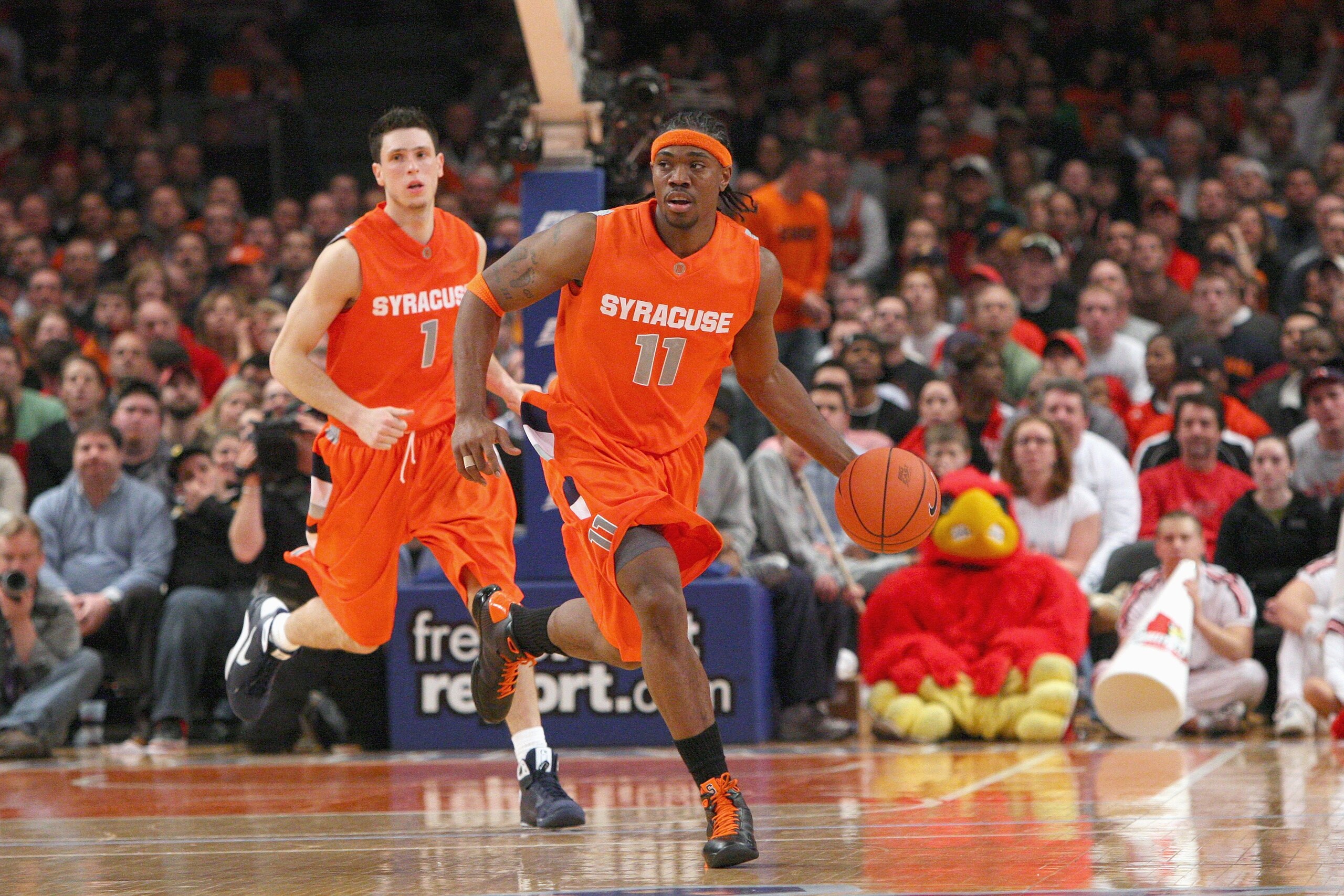 NEW YORK - MARCH 14:  Paul Harris #11 of the Syracuse Orange dribbles the ball downcourt against the Louisville Cardinals during the championship game of the Big East Tournament at Madison Square Garden on March 14, 2009 in New York City.  (Photo by Jim M