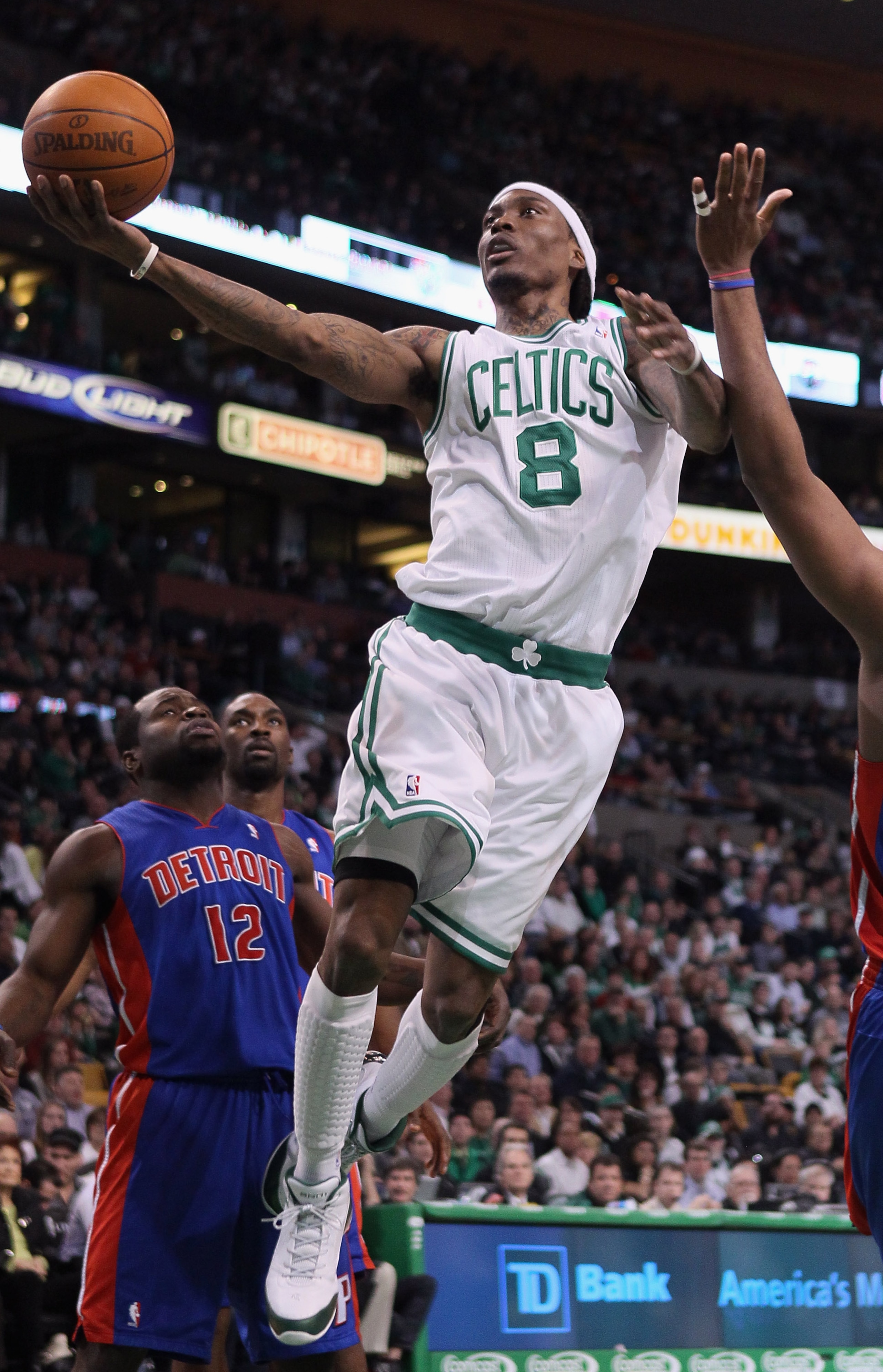 BOSTON, MA - JANUARY 19:  Marquis Daniels #8 of the Boston Celtics goes up for a shot as Will Bynum #12 of the Detroit Pistons defends on January 19, 2011 at the TD Garden in Boston, Massachusetts.  NOTE TO USER: User expressly acknowledges and agrees tha