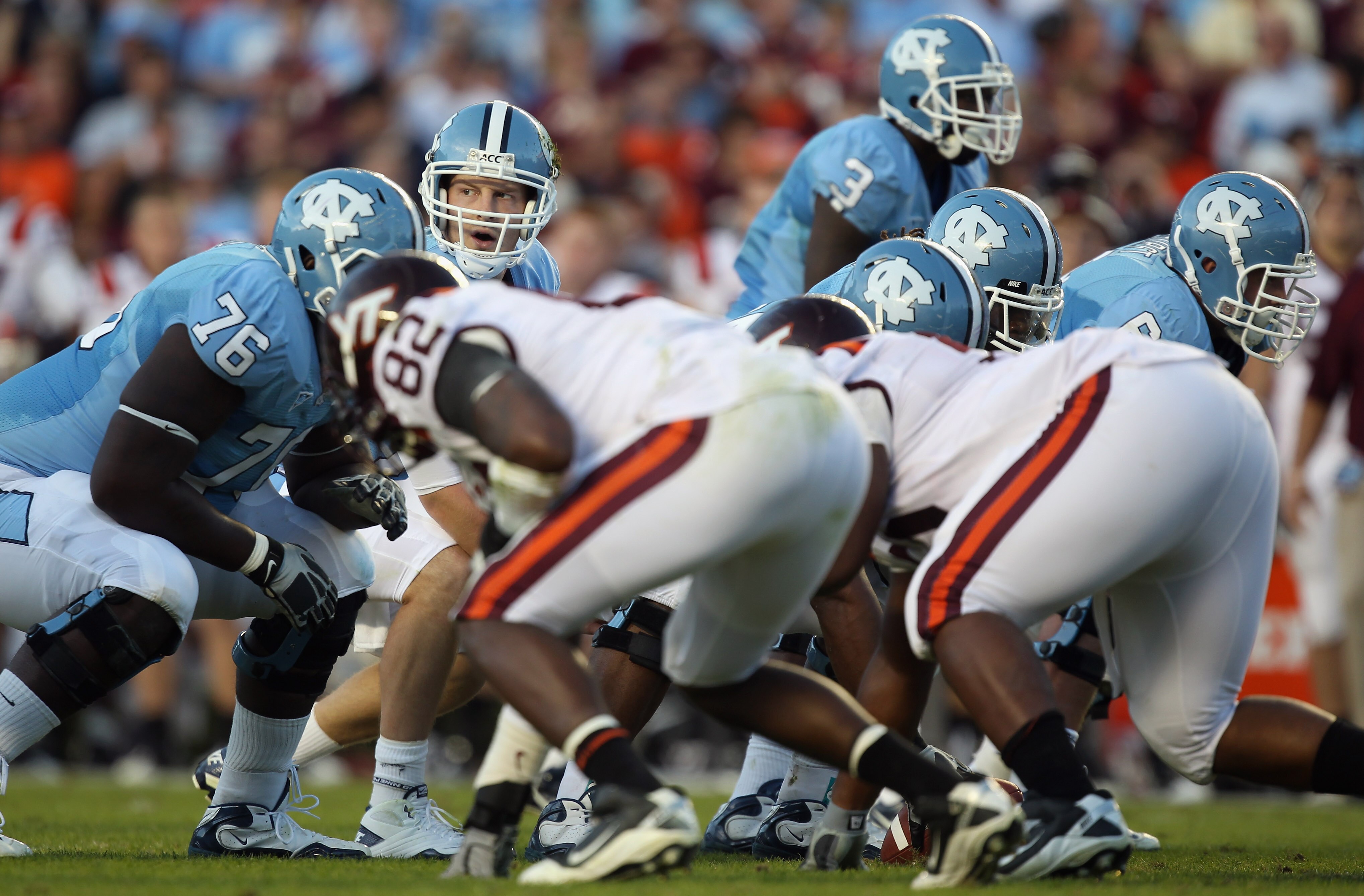 CHAPEL HILL, NC - NOVEMBER 13:  T.J. Yates #13 of the North Carolina Tar Heels waits for a play from the sidelines against the Virginia Tech Hokies during their game at Kenan Stadium on November 13, 2010 in Chapel Hill, North Carolina.  (Photo by Streeter