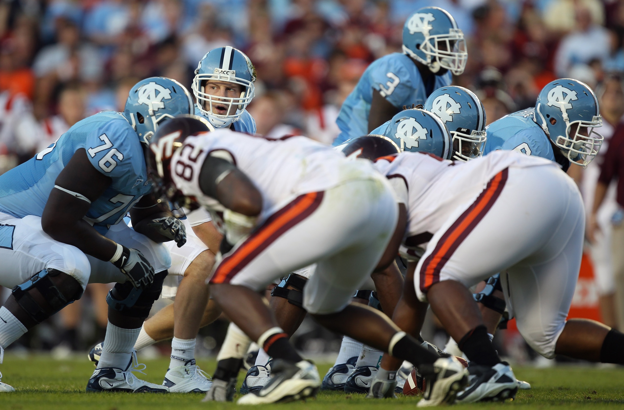CHAPEL HILL, NC - NOVEMBER 13:  T.J. Yates #13 of the North Carolina Tar Heels waits for a play from the sidelines against the Virginia Tech Hokies during their game at Kenan Stadium on November 13, 2010 in Chapel Hill, North Carolina.  (Photo by Streeter