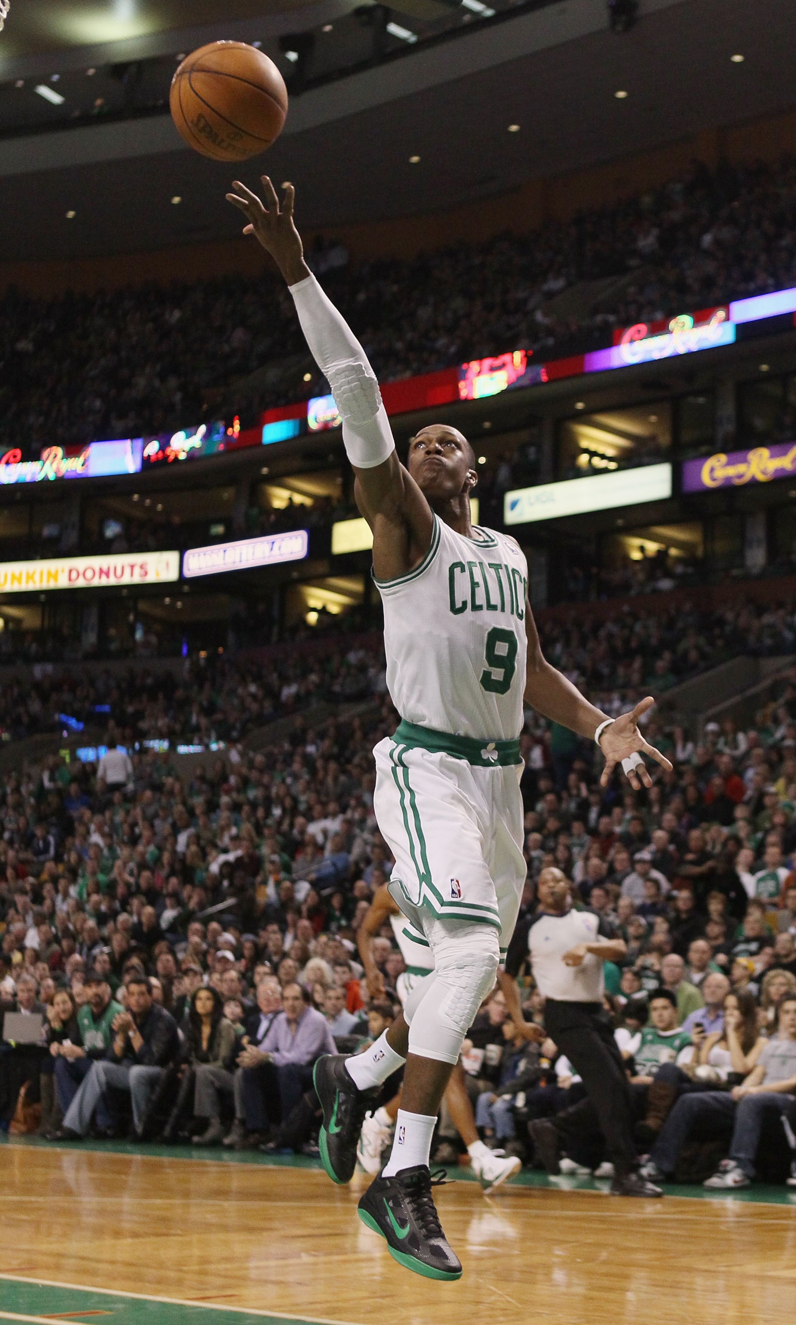 BOSTON, MA - FEBRUARY 06:  Rajon Rondo #9 of the Boston Celtics takes a shot against the Orlando Magic on February 6, 2011 at the TD Garden in Boston, Massachusetts. The Celtics defeated the Magic 91-80. NOTE TO USER: User expressly acknowledges and agree