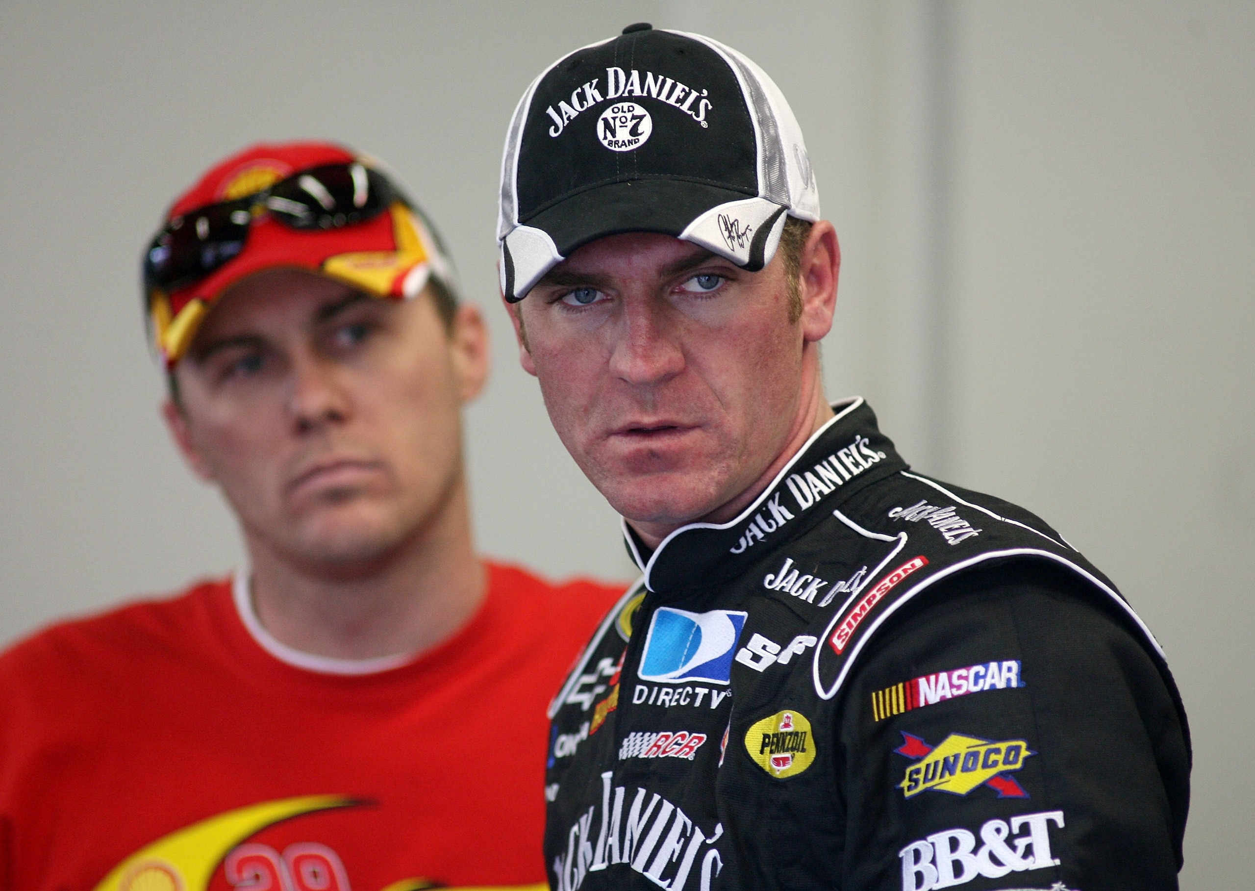 DAYTONA BEACH, FL - FEBRUARY 08: Clint Bowyer, driver of the #07 Jack Daniel's Chevrolet, stands with teammate Kevin Harvick during practice for the Budweiser Shootout at Daytona International Speedway on February 8, 2008 in Daytona, Florida.  (Photo by M