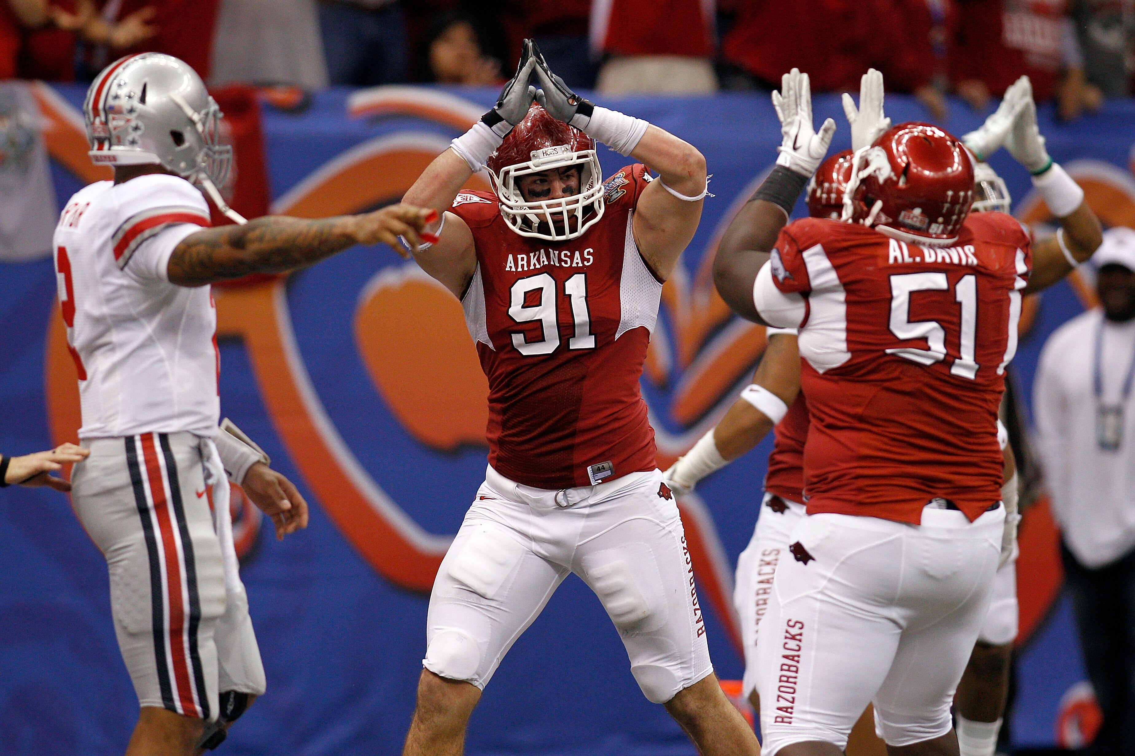 NEW ORLEANS, LA - JANUARY 04:  Jake Bequette #91 of the Arkansas Razorbacks signals a safety after stopping running back Dan Herron #1 of the Ohio State Buckeyes in the endzone in the fourth quarter during the Allstate Sugar Bowl at the Louisiana Superdom