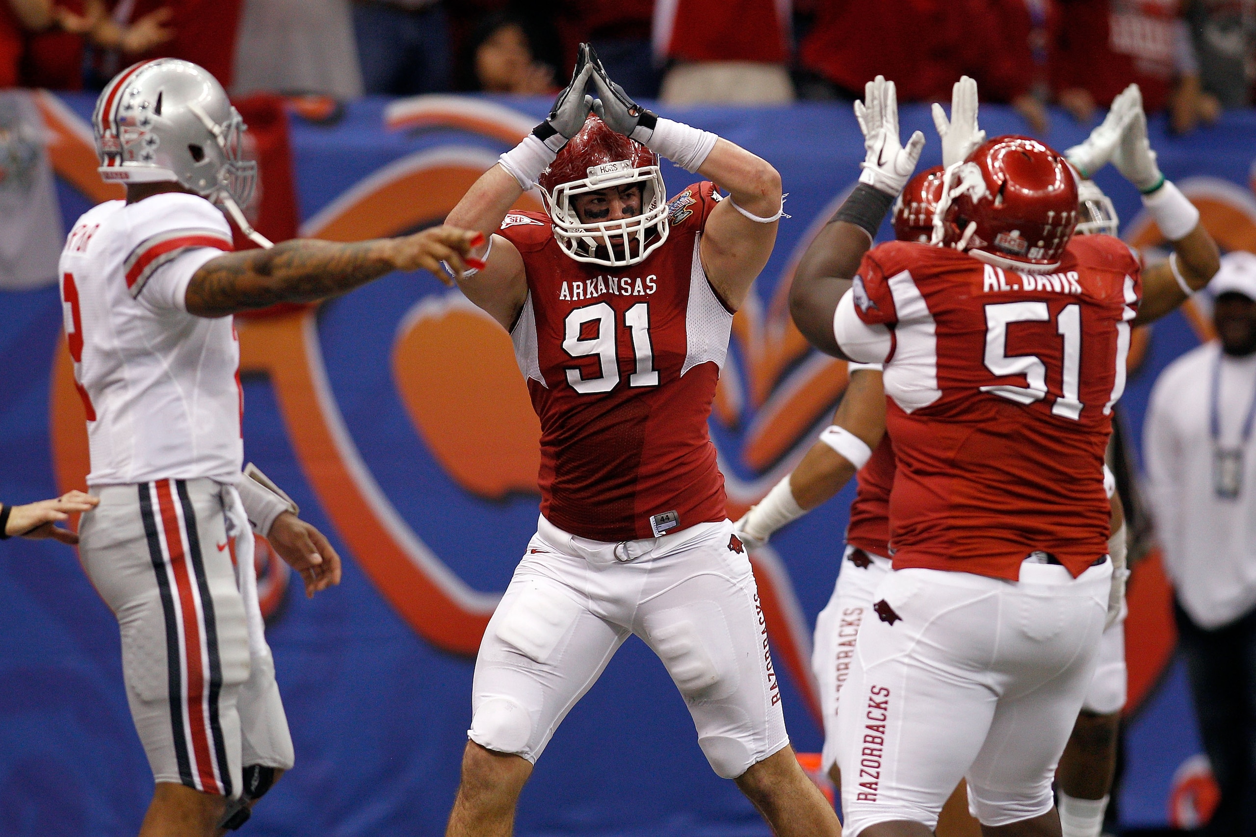 NEW ORLEANS, LA - JANUARY 04:  Jake Bequette #91 of the Arkansas Razorbacks signals a safety after stopping running back Dan Herron #1 of the Ohio State Buckeyes in the endzone in the fourth quarter during the Allstate Sugar Bowl at the Louisiana Superdom