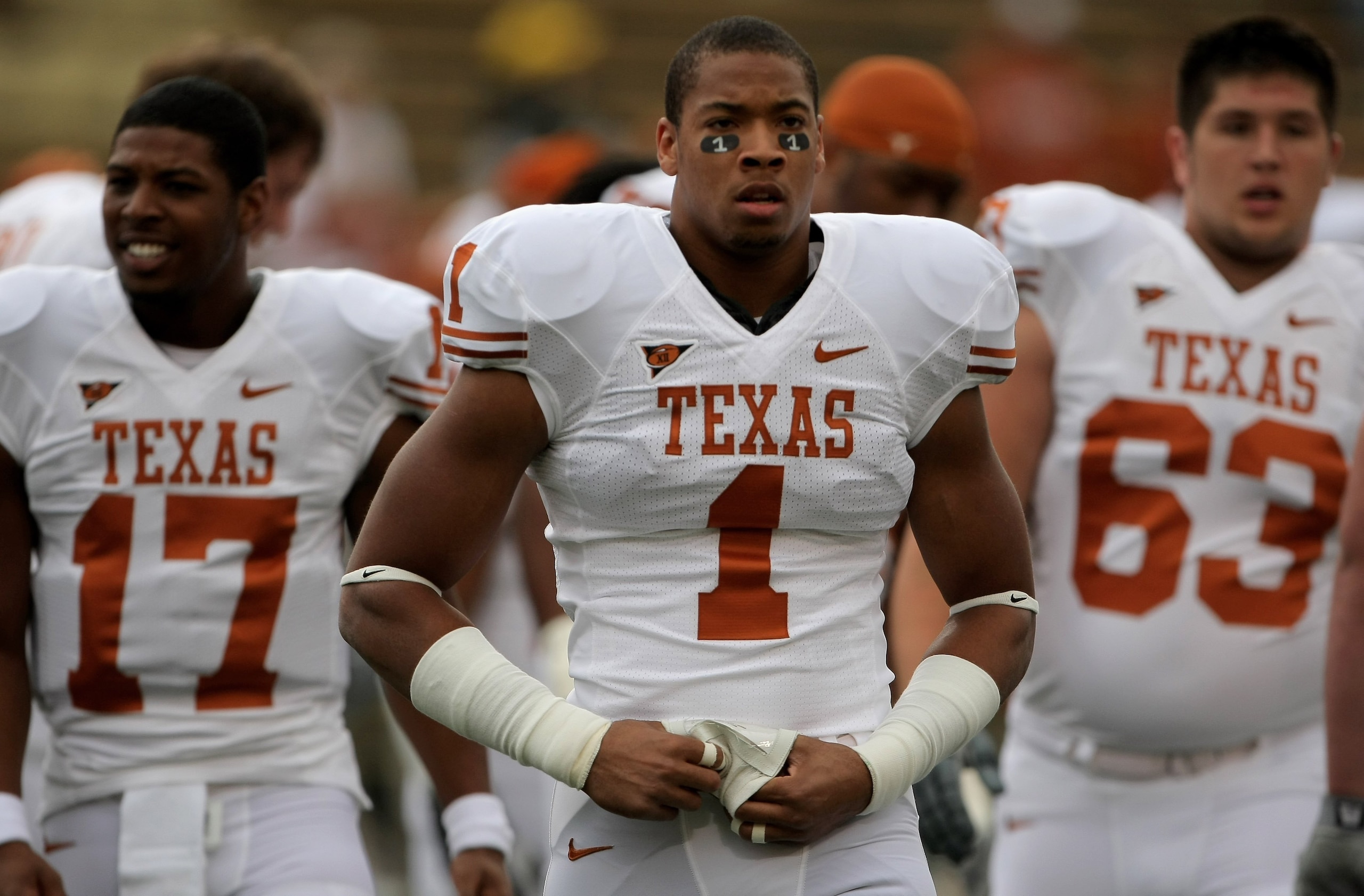 BOULDER, CO - OCTOBER 04:  Keenan Robinson #1, Trevor Gerland #17, and Michael Huey #63 of the Texas Longhorns warm up prior to facing the Colorado Buffaloes at Folsom Field on October 4, 2008 in Boulder, Colorado. Texas defeated Colorado 38-14.  (Photo b