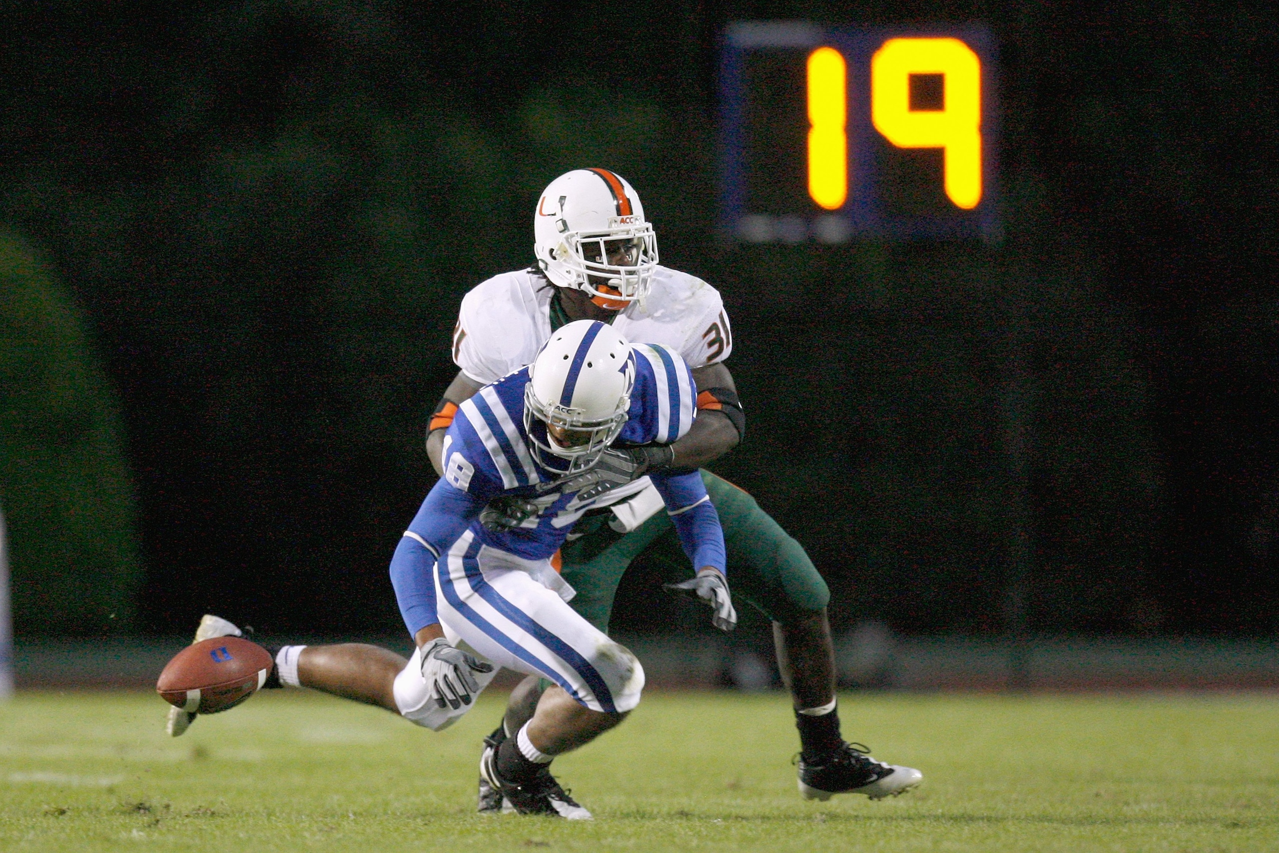 DURHAM, NC - OCTOBER 18:  Jeremy Ringfield #18 of the Duke Blue Devils drops the ball as he is hit by Sean Spence #31 of the Miami Hurricanes at Wallace Wade Stadium on October 18, 2008 in Durham, North Carolina.  (Photo by Kevin C. Cox/Getty Images)