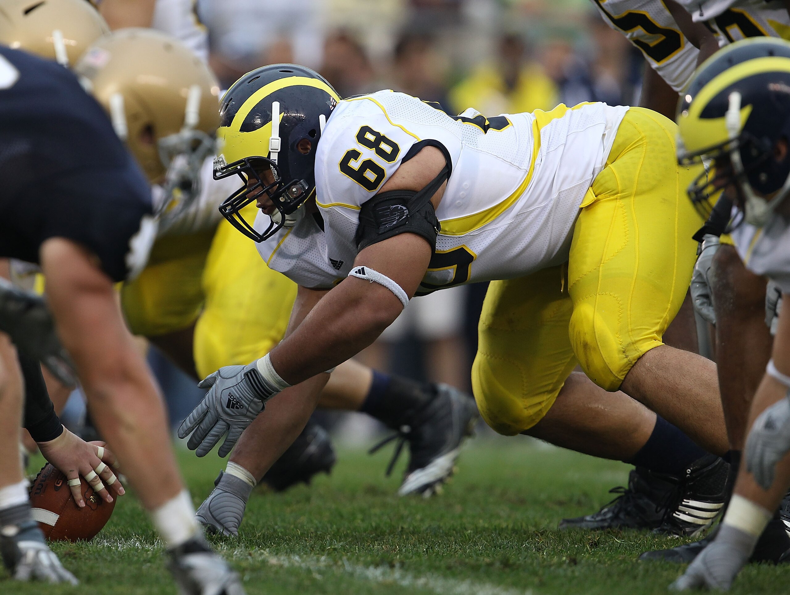 SOUTH BEND, IN - SEPTEMBER 11: Mike Martin #68 of the Michigan Wolverines awaits the start of play against the Notre Dame Fighting Irish at Notre Dame Stadium on September 11, 2010 in South Bend, Indiana. Michigan defeated Notre Dame 28-24.  (Photo by Jon