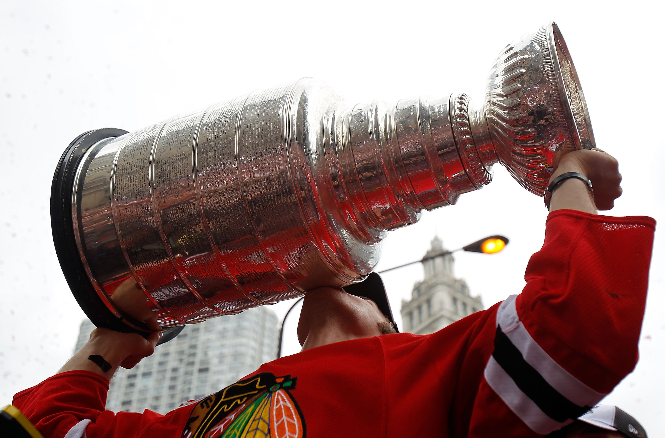 CHICAGO - JUNE 11: Niklas Hjalmarsson #4 kisses the Stanley Cup trophy during the Chicago Blackhawks Stanley Cup victory parade and rally on June 11, 2010 in Chicago, Illinois. (Photo by Jonathan Daniel/Getty Images)