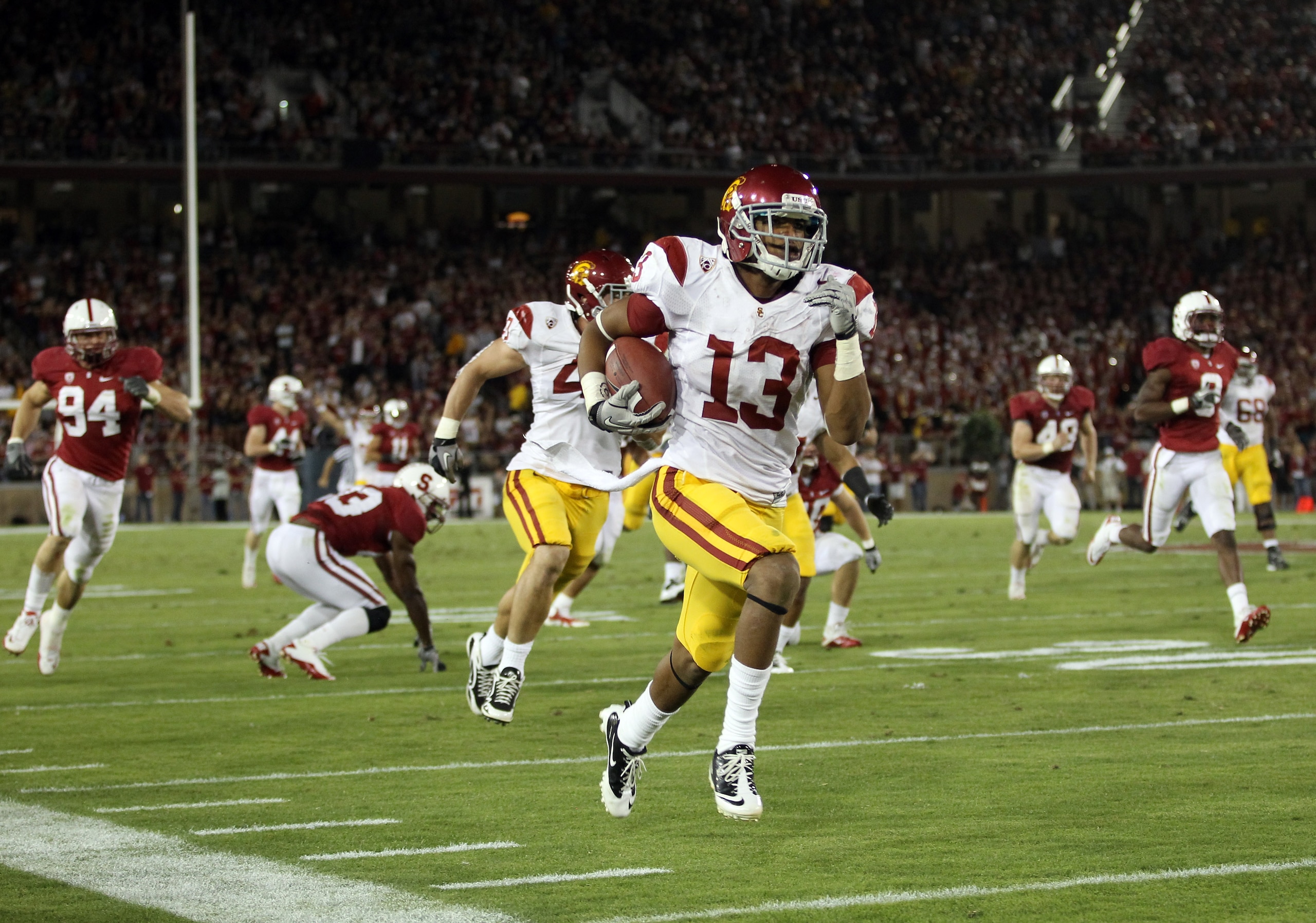 PALO ALTO, CA - OCTOBER 09:  Robert Woods #13 of the USC Trojans runs the ball in for a touchdown against the Stanford Cardinal at Stanford Stadium on October 9, 2010 in Palo Alto, California.  (Photo by Ezra Shaw/Getty Images)