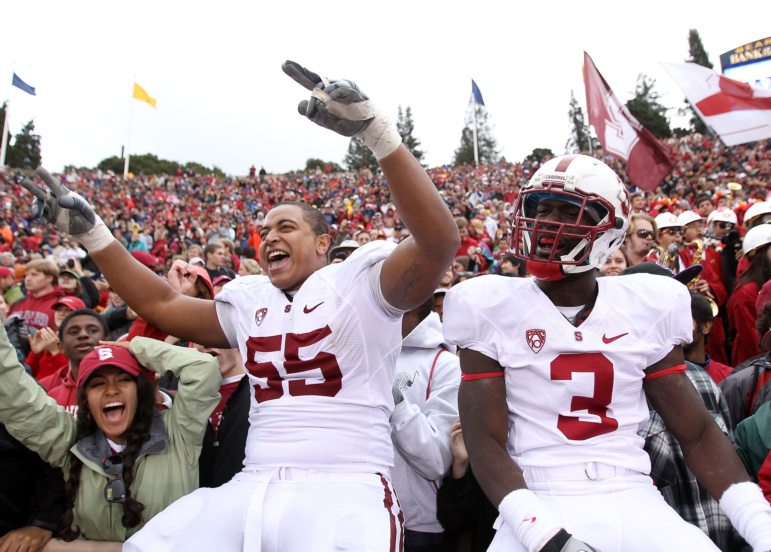 BERKELEY, CA - NOVEMBER 20:  Michael Thomas #3 and Jonathan Martin #55 of the Stanford Cardinal celebrate after beating the California Golden Bears at California Memorial Stadium on November 20, 2010 in Berkeley, California.  (Photo by Ezra Shaw/Getty Ima