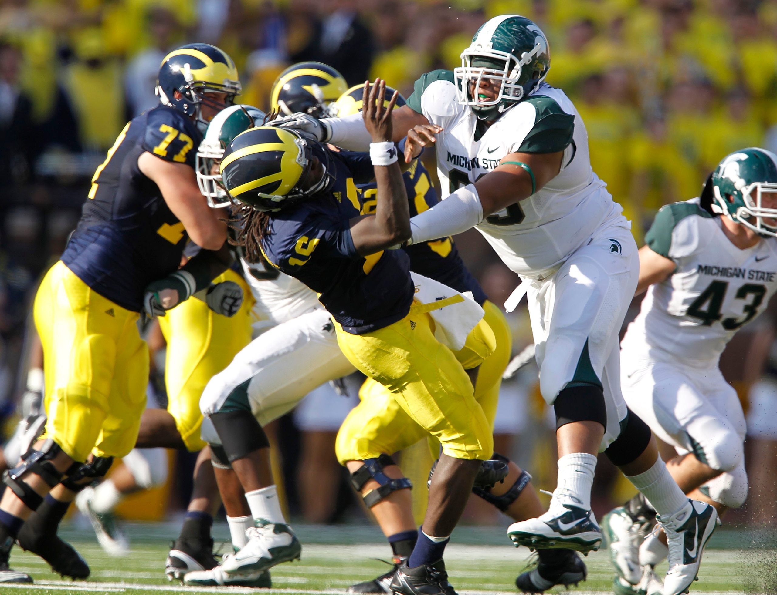 ANN ARBOR, MI - OCTOBER 09: Jerel Worthy #99 of the Michigan State Spartans hits Denard Robinson #16 of the Michigan Wolverines during the game on October 9, 2010 at Michigan Stadium in Ann Arbor, Michigan. (Photo by Leon Halip/Getty Images)