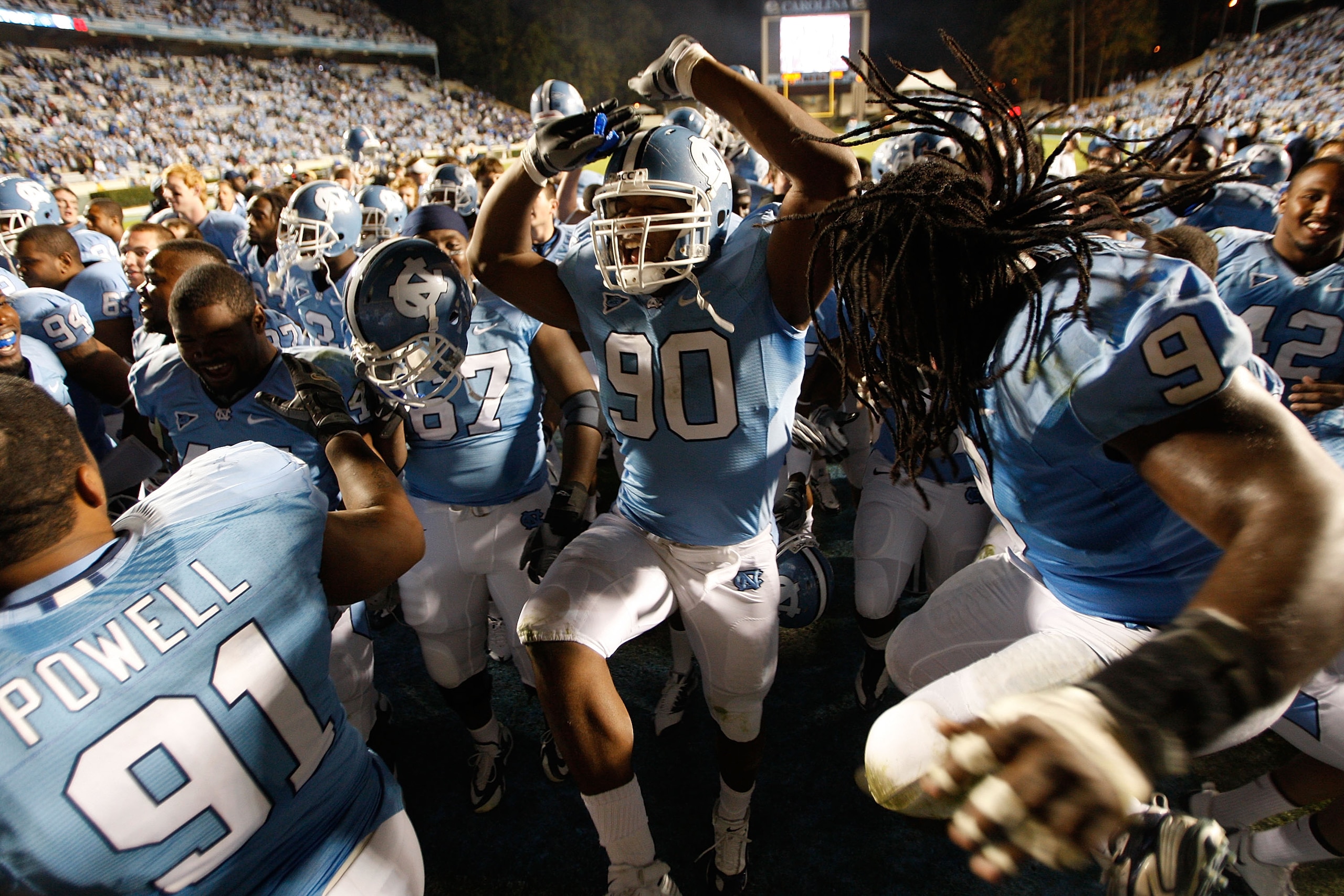 CHAPEL HILL, NC - NOVEMBER 07:  Quinton Coples #90 of the North Carolina Tar Heels celebrates with teammates after a 19-6 victory over the Duke Blue Devils during their game at Kenan Stadium on November 7, 2009 in Chapel Hill, North Carolina.  (Photo by S
