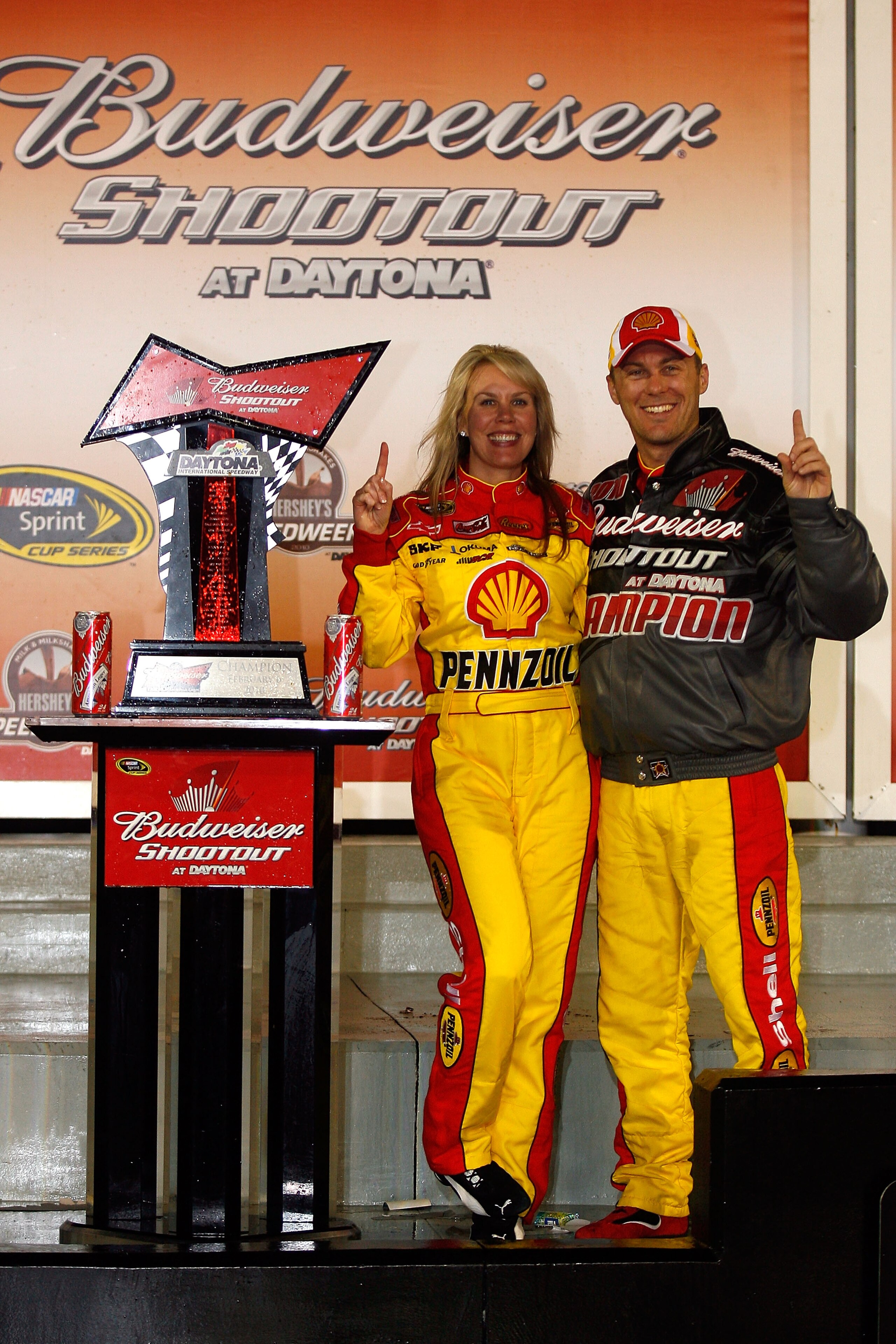DAYTONA BEACH, FL - FEBRUARY 06:  Kevin Harvick (R), driver of the #29 Shell/Pennzoil Chevrolet, celebrates winning the Budweiser Shootout with his wife DeLana at Daytona International Speedway on February 6, 2010 in Daytona Beach, Florida.  (Photo by Jas