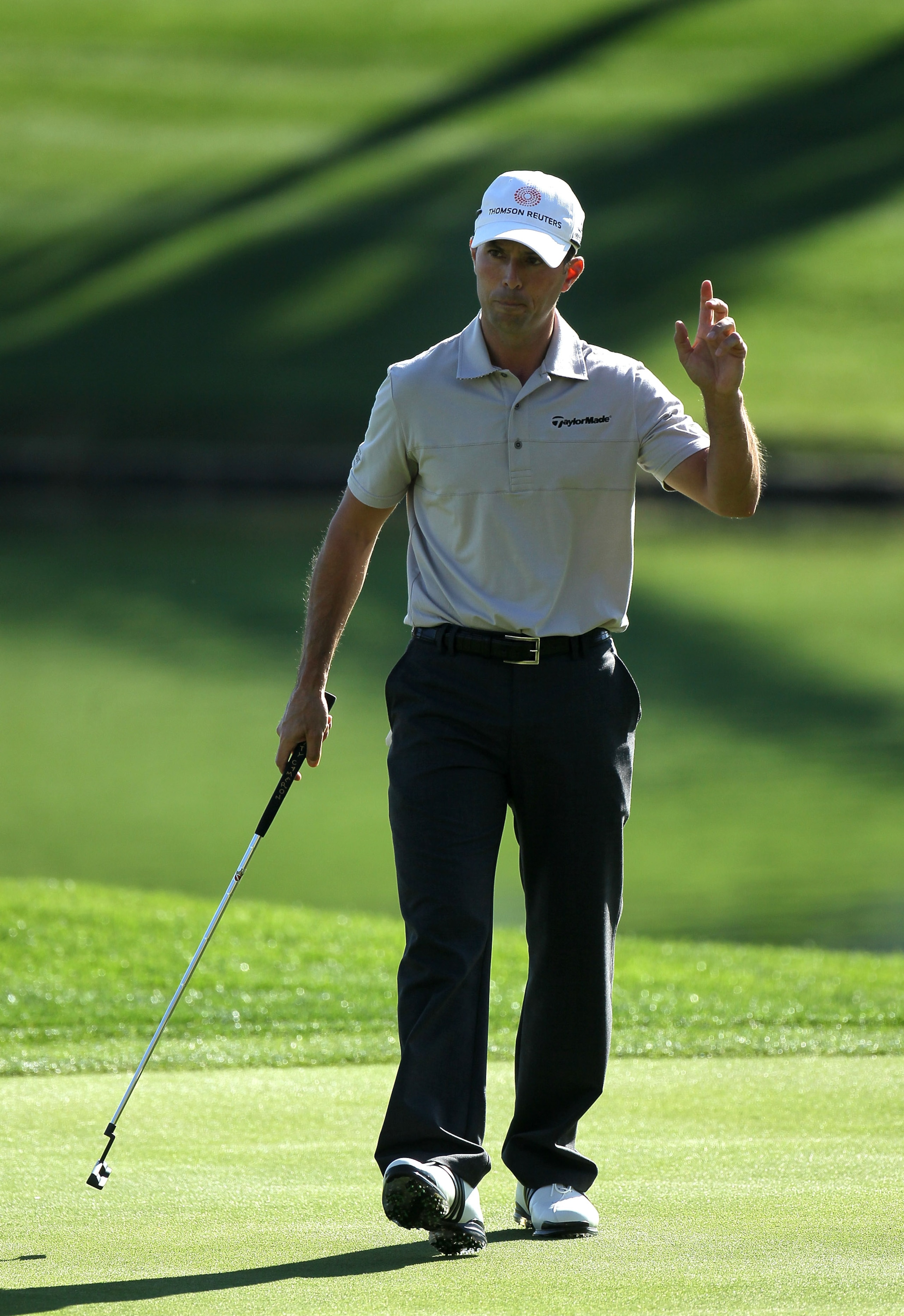 LA QUINTA, CA - JANUARY 19:  Mike Weir of Canada waves after maiking a birdie on the fourth hole during round one of the Bob Hope Classic at the Palmer Private Course at PGA West on January 19, 2011 in La Quinta, California.  (Photo by Stephen Dunn/Getty