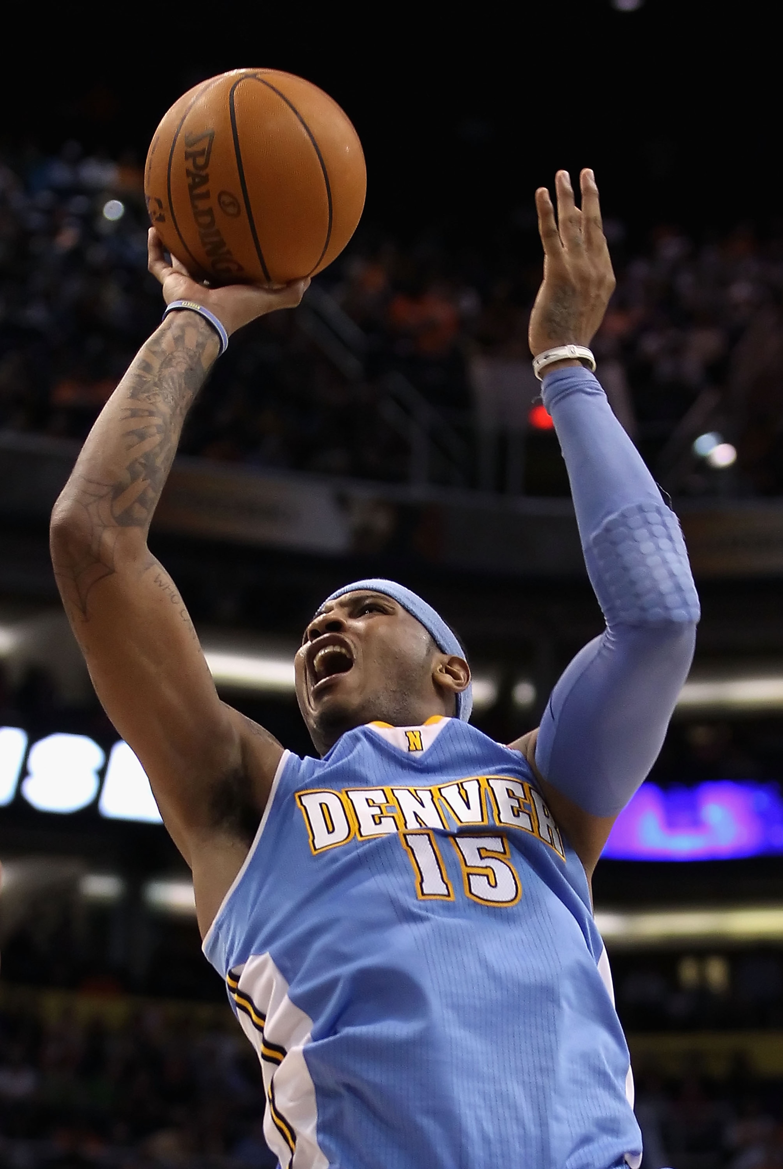 PHOENIX - NOVEMBER 15:  Carmelo Anthony #15 of the Denver Nuggets puts up a shot during the NBA game against the Phoenix Suns at US Airways Center on November 15, 2010 in Phoenix, Arizona.  The Suns defeated the Nuggets 100-94.  NOTE TO USER: User express