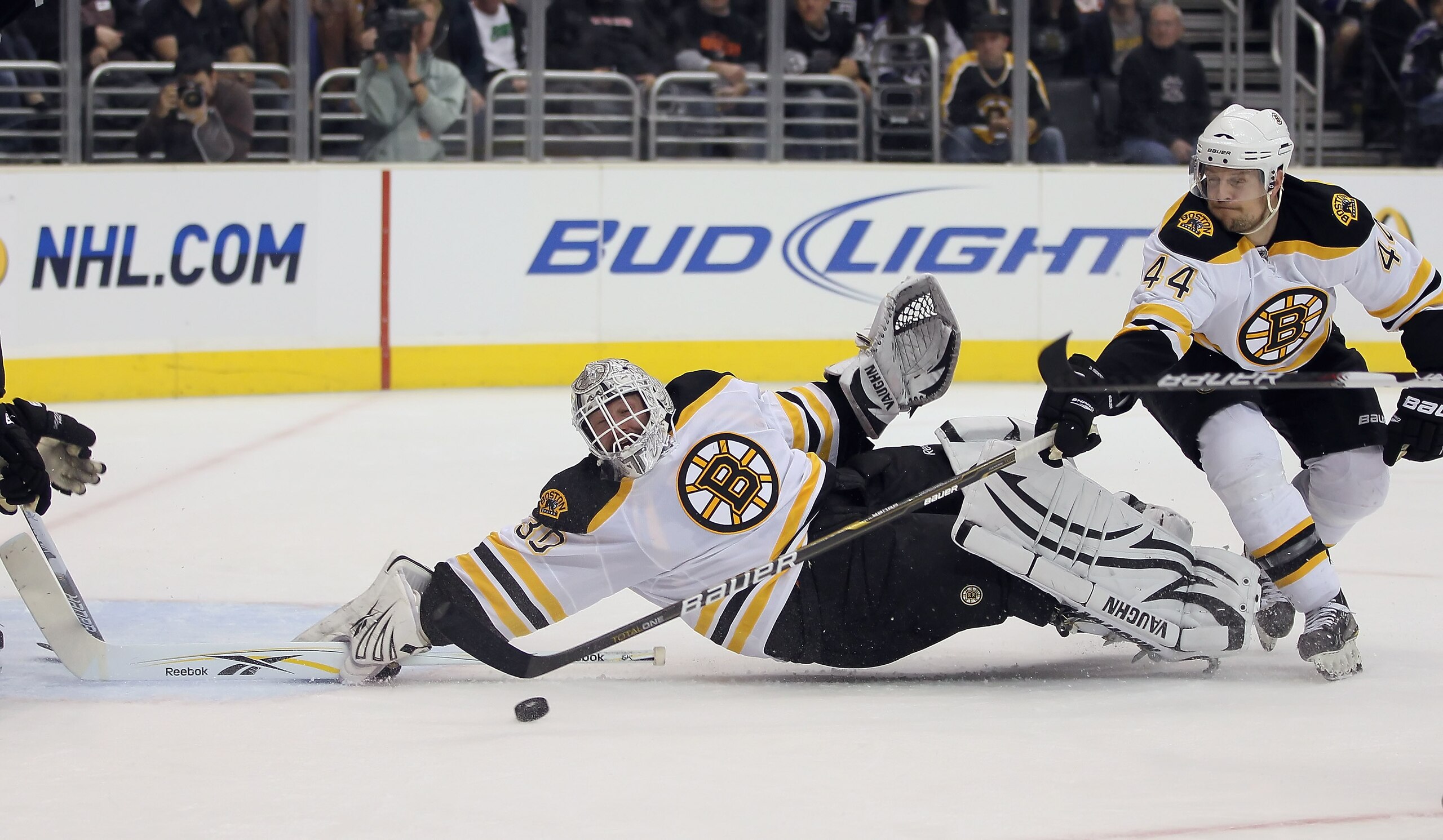 LOS ANGELES, CA - JANUARY 24: Goaltender Tim Thomas #30 of the Boston Bruins lunges for the puck as teammate Dennis Seidenberg #44 defends against the Los Angeles Kings in the second period at Staples Center on January 24, 2011 in Los Angeles, California LOS ANGELES, CA - JANUARY 24: Goaltender Tim Thomas #30 of the Boston Bruins lunges for the puck as teammate Dennis Seidenberg #44 defends against the Los Angeles Kings in the second period at Staples Center on January 24, 2011 in Los Angeles, California