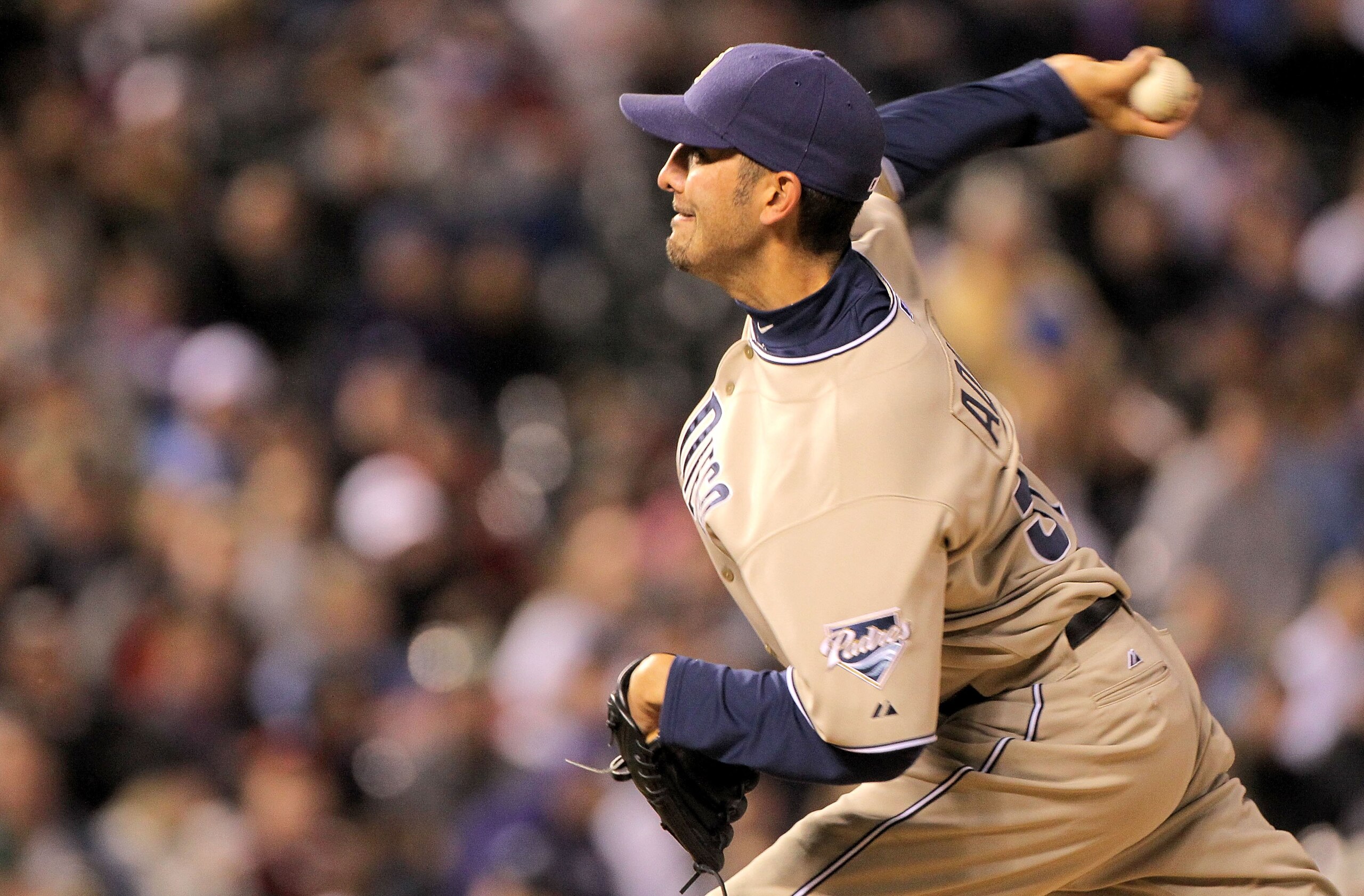 DENVER - APRIL 10:  Relief pitcher Mike Adams #37 of the San Diego Padres delivers against the Colorado Rockies during MLB action at Coors Field on April 10, 2010 in Denver, Colorado. The Padres defeated the Rockies 5-4 in 14 innings.  (Photo by Doug Pens