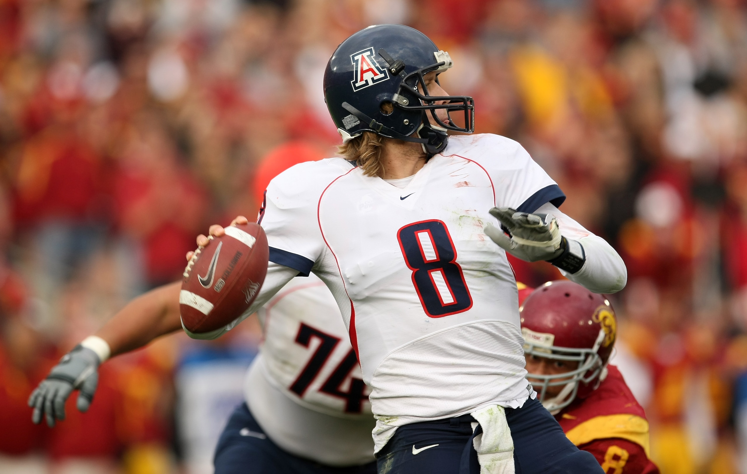 LOS ANGELES, CA - DECEMBER 05:  Quarterback Nick Foles #8 of the Arizona Wildcats throws a pass against the USC Trojans on December 5, 2009 at the Los Angeles Coliseum in Los Angeles, California. Arizona won 21-17.  (Photo by Stephen Dunn/Getty Images)