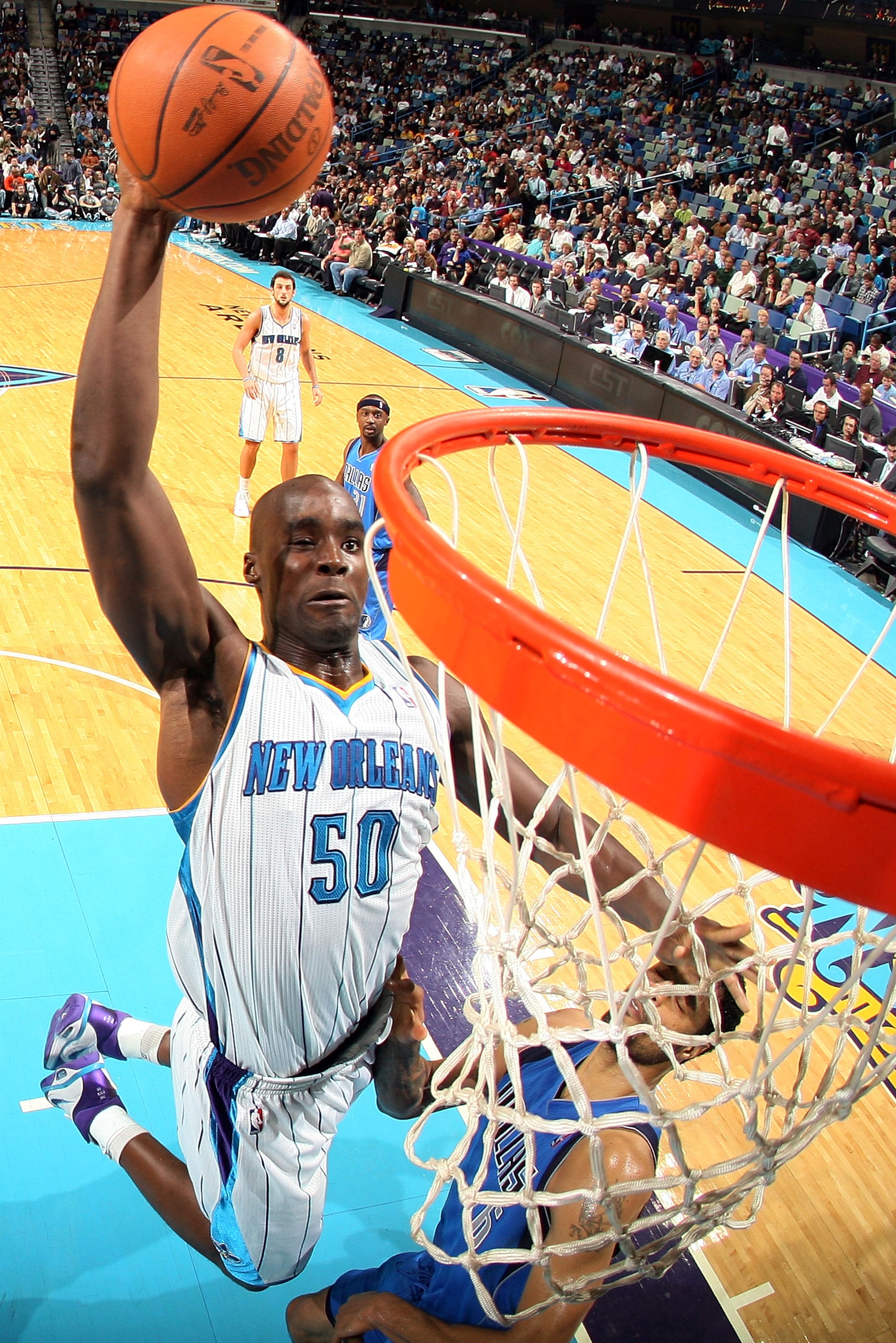 NEW ORLEANS - NOVEMBER 17:  Emeka Okafor #50 of the New Orleans Hornets dunks the ball against the Dallas Mavericks at the New Orleans Arena on November 17, 2010 in New Orleans, Louisiana.  The Hornets defeated the Mavericks 99-97.  NOTE TO USER: User exp