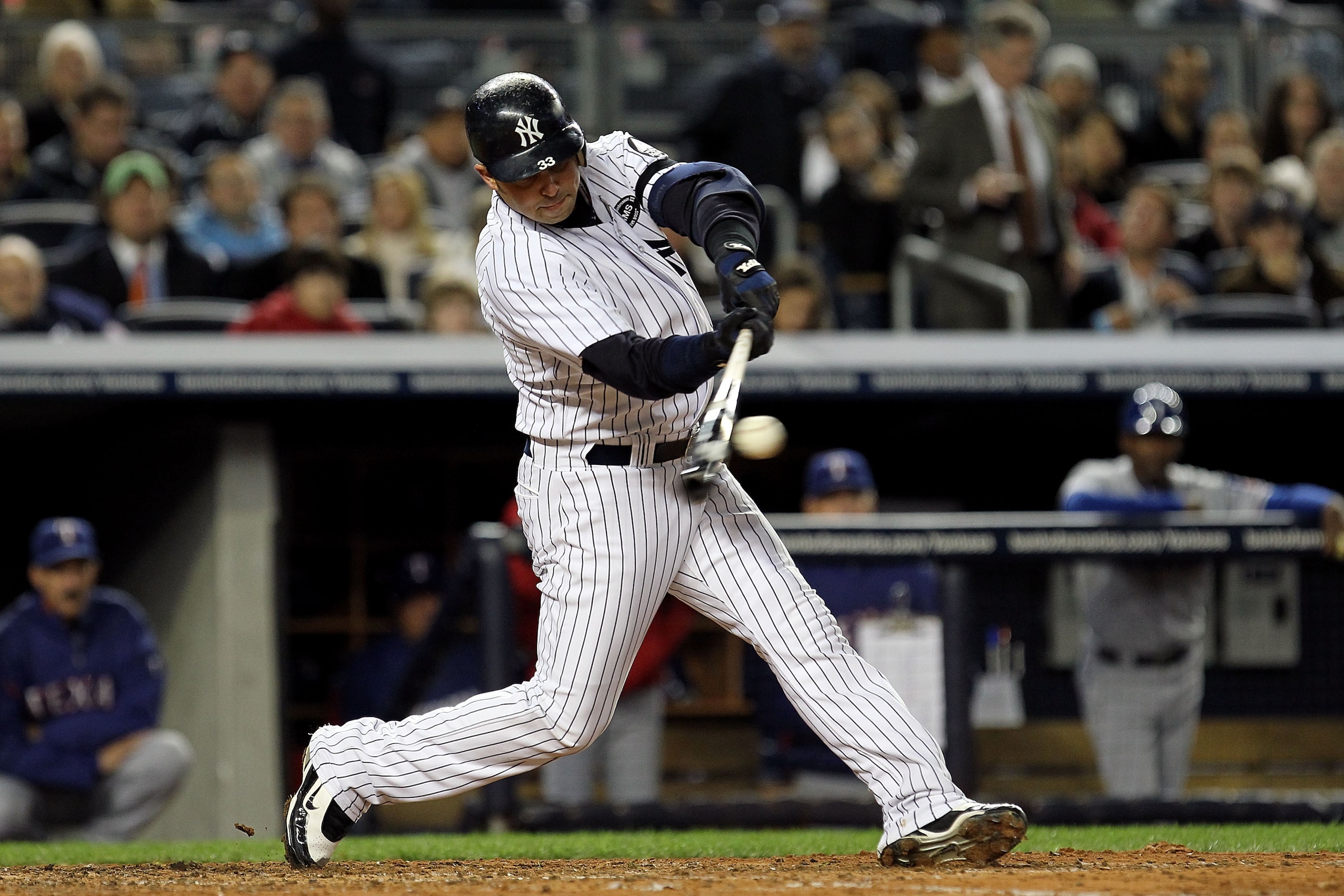 NEW YORK - OCTOBER 18: Nick Swisher #33 of the New York Yankees bats against the Texas Rangers in Game Three of the ALCS during the 2010 MLB Playoffs at Yankee Stadium on October 18, 2010 in New York, New York. The Rangers won 8-0. (Photo by Al Bello/Get NEW YORK - OCTOBER 18: Nick Swisher #33 of the New York Yankees bats against the Texas Rangers in Game Three of the ALCS during the 2010 MLB Playoffs at Yankee Stadium on October 18, 2010 in New York, New York. The Rangers won 8-0. (Photo by Al Bello/Get