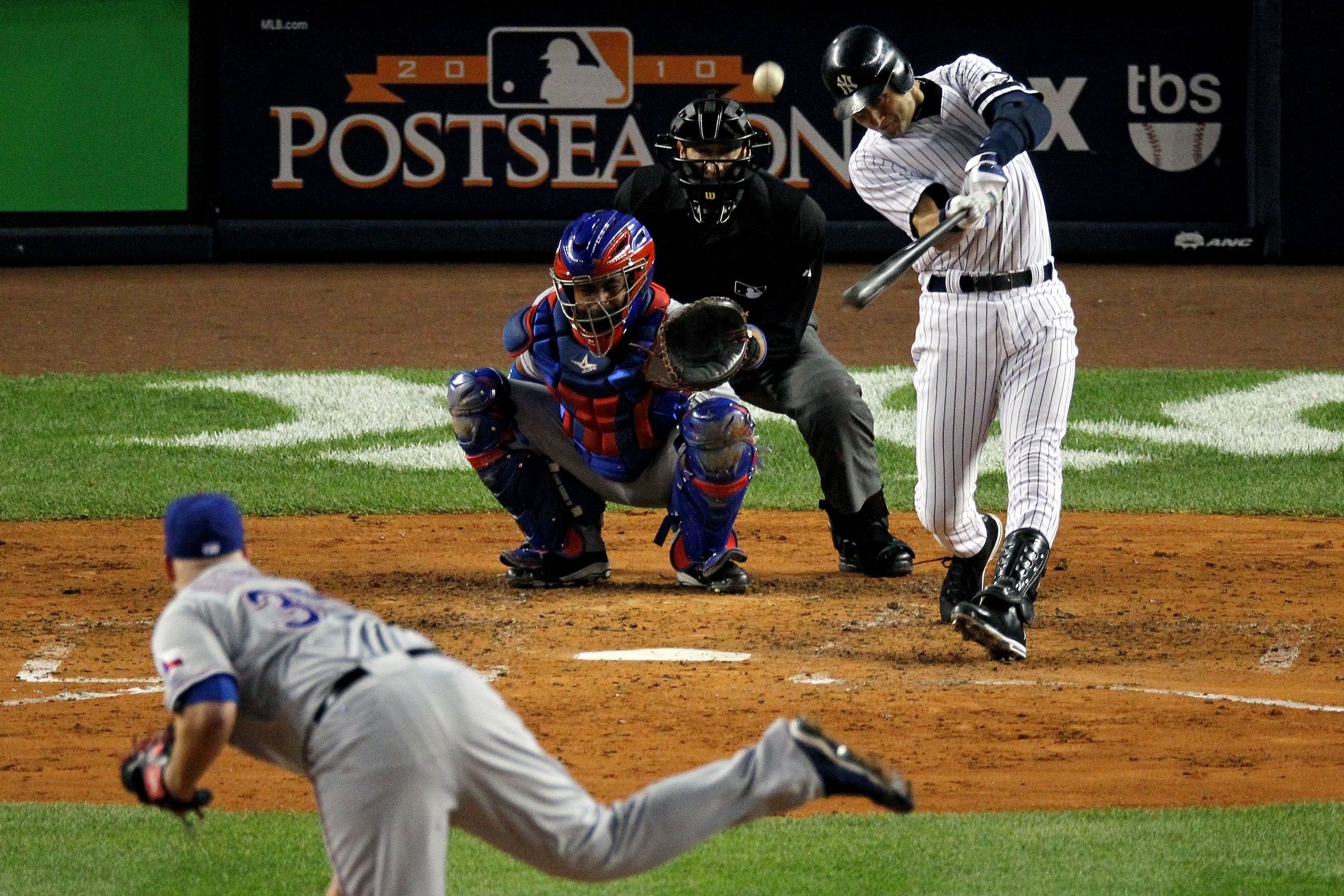 NEW YORK - OCTOBER 19: Derek Jeter #2 of the New York Yankees hits a triple in the third inning against Tommy Hunter #35 of the Texas Rangers in Game Four of the ALCS during the 2010 MLB Playoffs at Yankee Stadium on October 19, 2010 in the Bronx borough NEW YORK - OCTOBER 19: Derek Jeter #2 of the New York Yankees hits a triple in the third inning against Tommy Hunter #35 of the Texas Rangers in Game Four of the ALCS during the 2010 MLB Playoffs at Yankee Stadium on October 19, 2010 in the Bronx borough