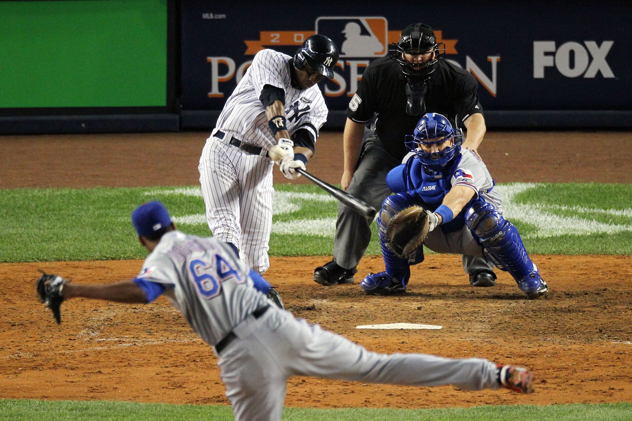 NEW YORK - OCTOBER 20: Curtis Granderson #14 of the New York Yankees hits a solo home run in the bottom of the eighth inning against Alexi Ogando #64 of the Texas Rangers in Game Five of the ALCS during the 2010 MLB Playoffs at Yankee Stadium on October NEW YORK - OCTOBER 20: Curtis Granderson #14 of the New York Yankees hits a solo home run in the bottom of the eighth inning against Alexi Ogando #64 of the Texas Rangers in Game Five of the ALCS during the 2010 MLB Playoffs at Yankee Stadium on October