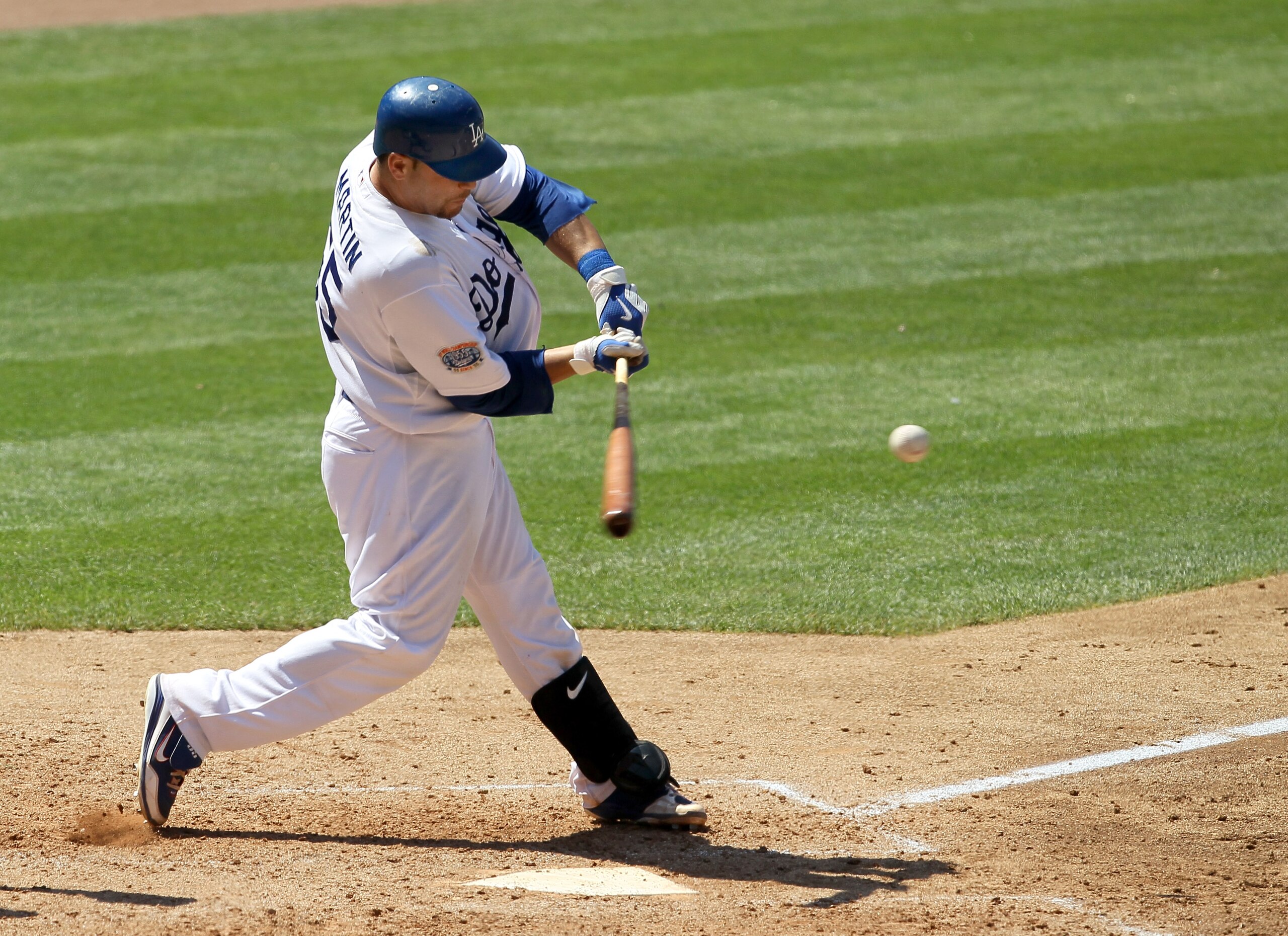 LOS ANGELES, CA - JULY 25: Russell Martin #55 of the Los Angeles Dodgers hits an RBI double which accounts for the game's only run in the eighth nning against the New York Mets on July 25, 2010 at Dodger Stadium in Los Angeles, California. The Dodgers LOS ANGELES, CA - JULY 25: Russell Martin #55 of the Los Angeles Dodgers hits an RBI double which accounts for the game's only run in the eighth nning against the New York Mets on July 25, 2010 at Dodger Stadium in Los Angeles, California. The Dodgers