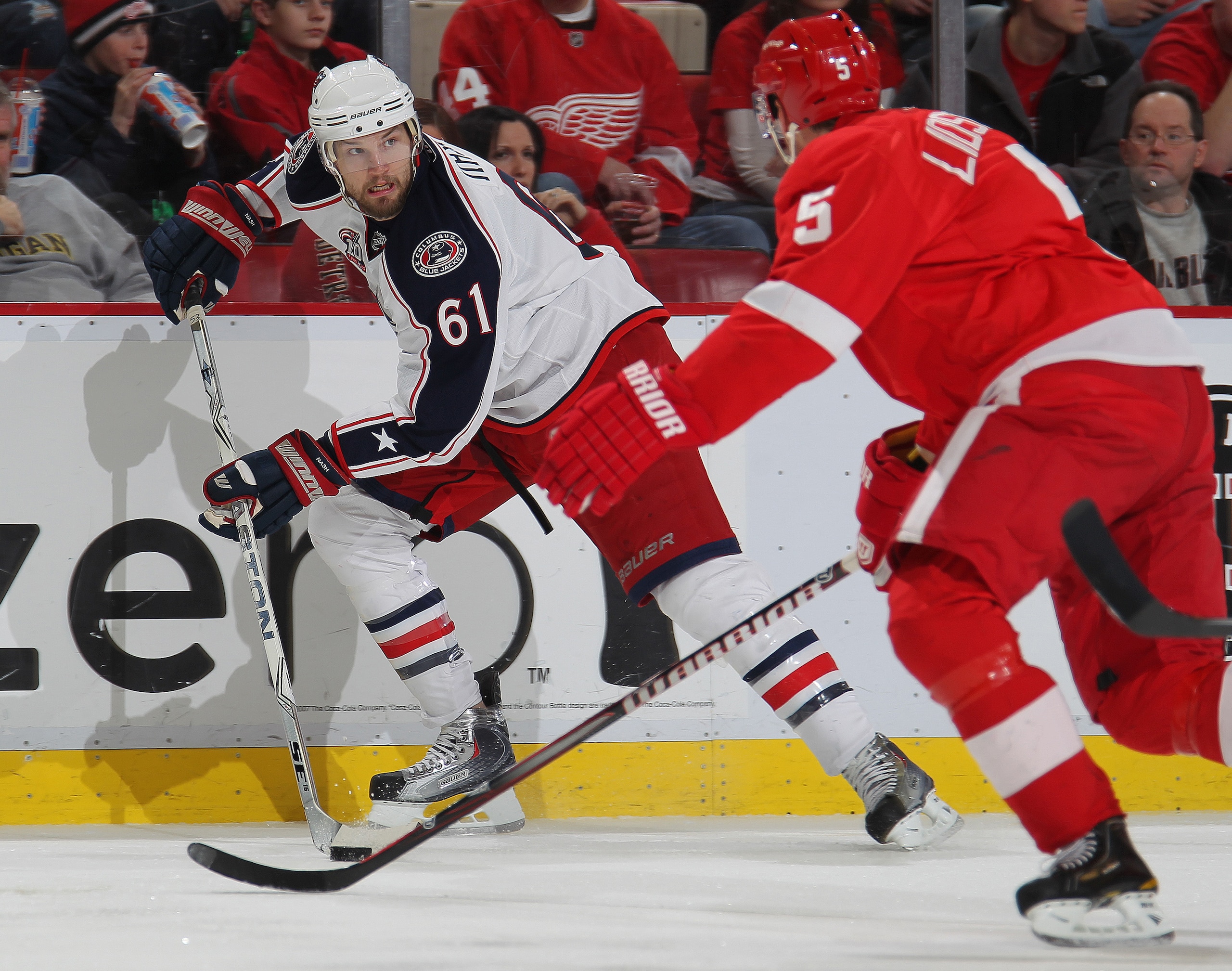 DETROIT, MI - FEBRUARY 4: Rick Nash #61 of the Columbus Blue Jackets skates away from the checking Nicklas Lidstrom #5 of the Detroit Red Wings in a game on February 4, 2011 at the Joe Louis Arena in Detroit, Michigan. The Blue Jackets defeated the Wings DETROIT, MI - FEBRUARY 4: Rick Nash #61 of the Columbus Blue Jackets skates away from the checking Nicklas Lidstrom #5 of the Detroit Red Wings in a game on February 4, 2011 at the Joe Louis Arena in Detroit, Michigan. The Blue Jackets defeated the Wings