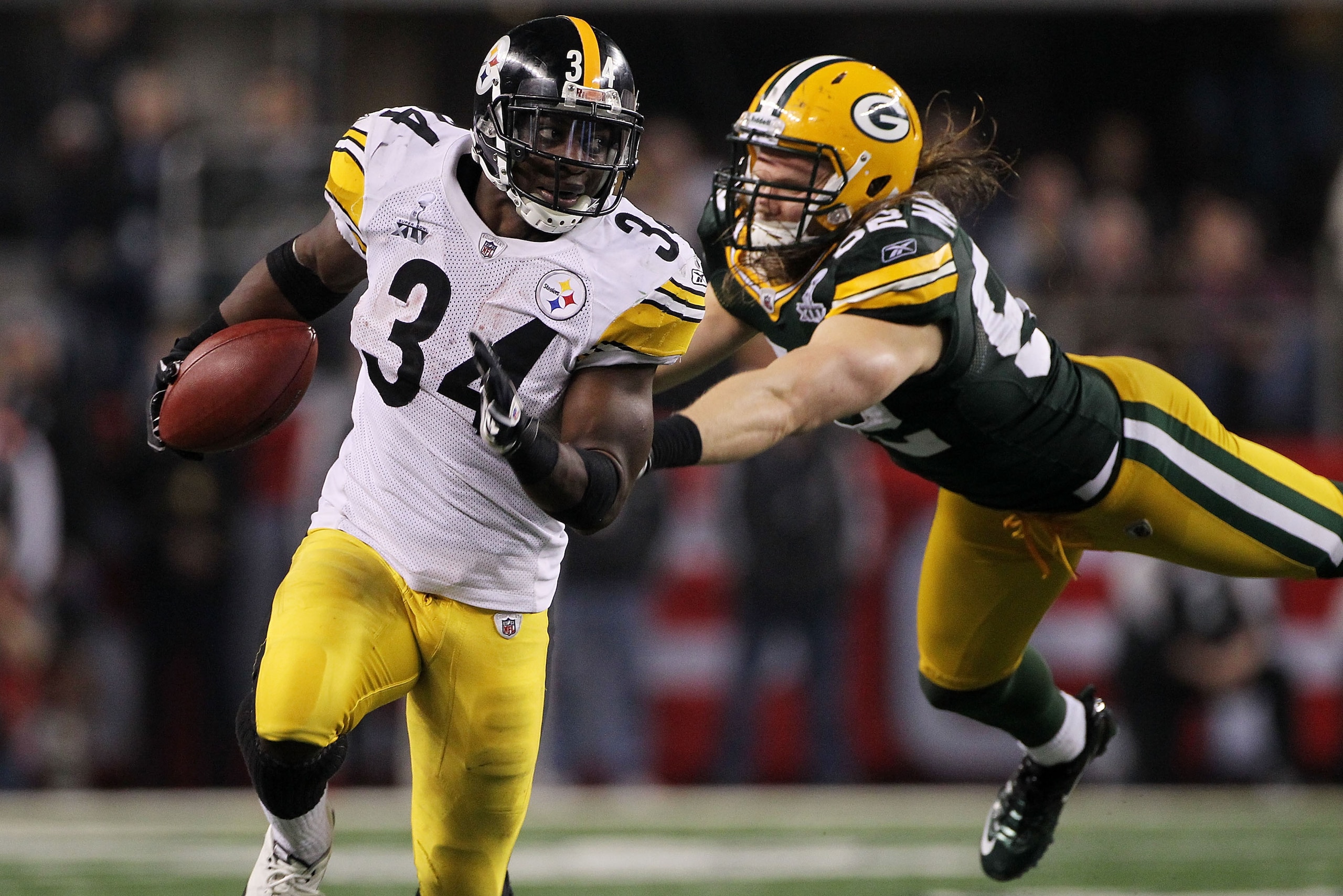 ARLINGTON, TX - FEBRUARY 06: Rashard Mendenhall #34 of the Pittsburgh Steelers tries to avoid the tackle of Clay Matthews #52 of the Green Bay Packers during the third quarter of Super Bowl XLV at Cowboys Stadium on February 6, 2011 in Arlington, Texas. ARLINGTON, TX - FEBRUARY 06: Rashard Mendenhall #34 of the Pittsburgh Steelers tries to avoid the tackle of Clay Matthews #52 of the Green Bay Packers during the third quarter of Super Bowl XLV at Cowboys Stadium on February 6, 2011 in Arlington, Texas.