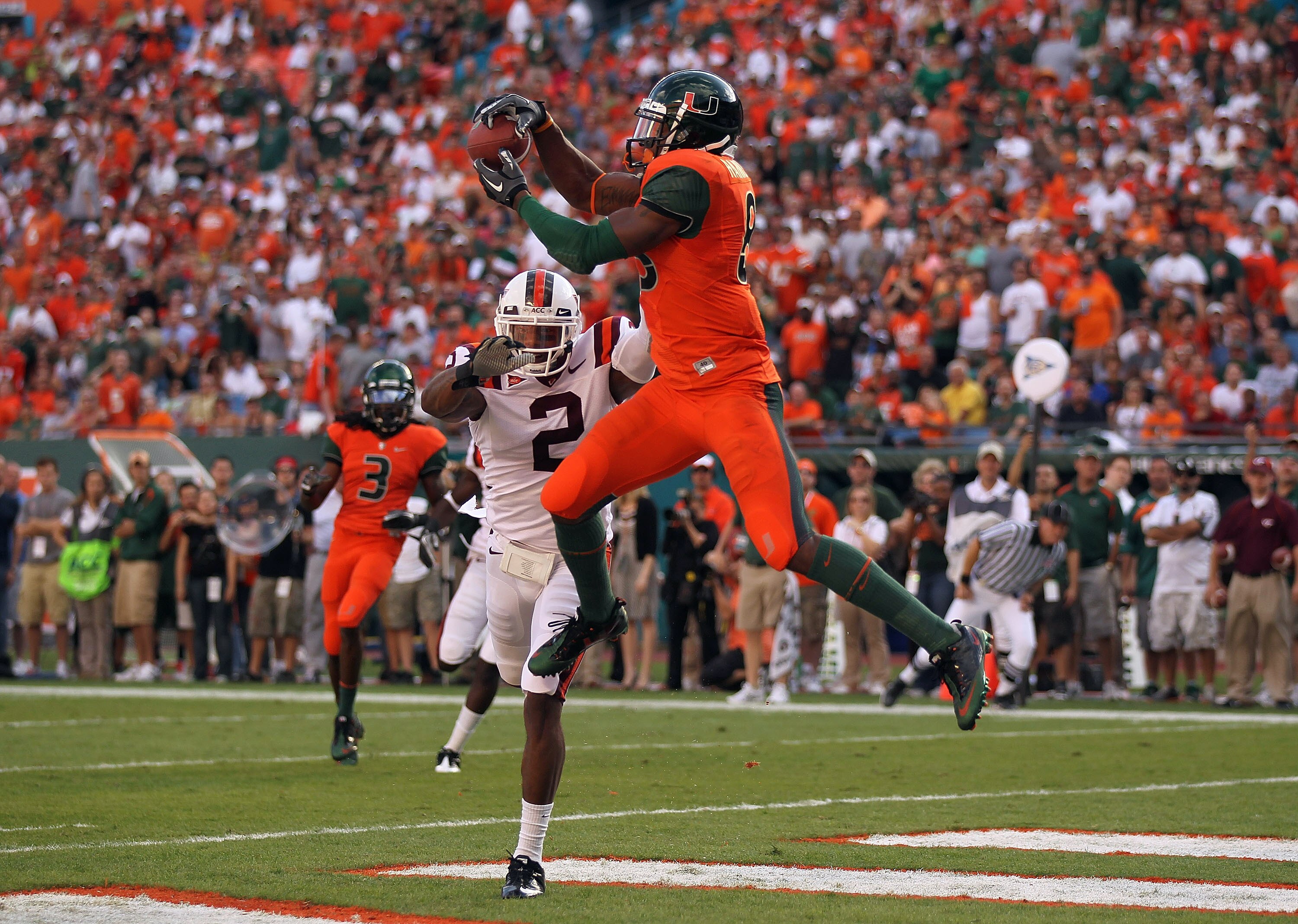MIAMI - NOVEMBER 20: Leonard Hankerson #85 of the Miami Hurricanes catches a touchdown over Davon Morgan #2 of the Virginia Tech Hokies at Sun Life Stadium on November 20, 2010 in Miami, Florida.  (Photo by Mike Ehrmann/Getty Images)