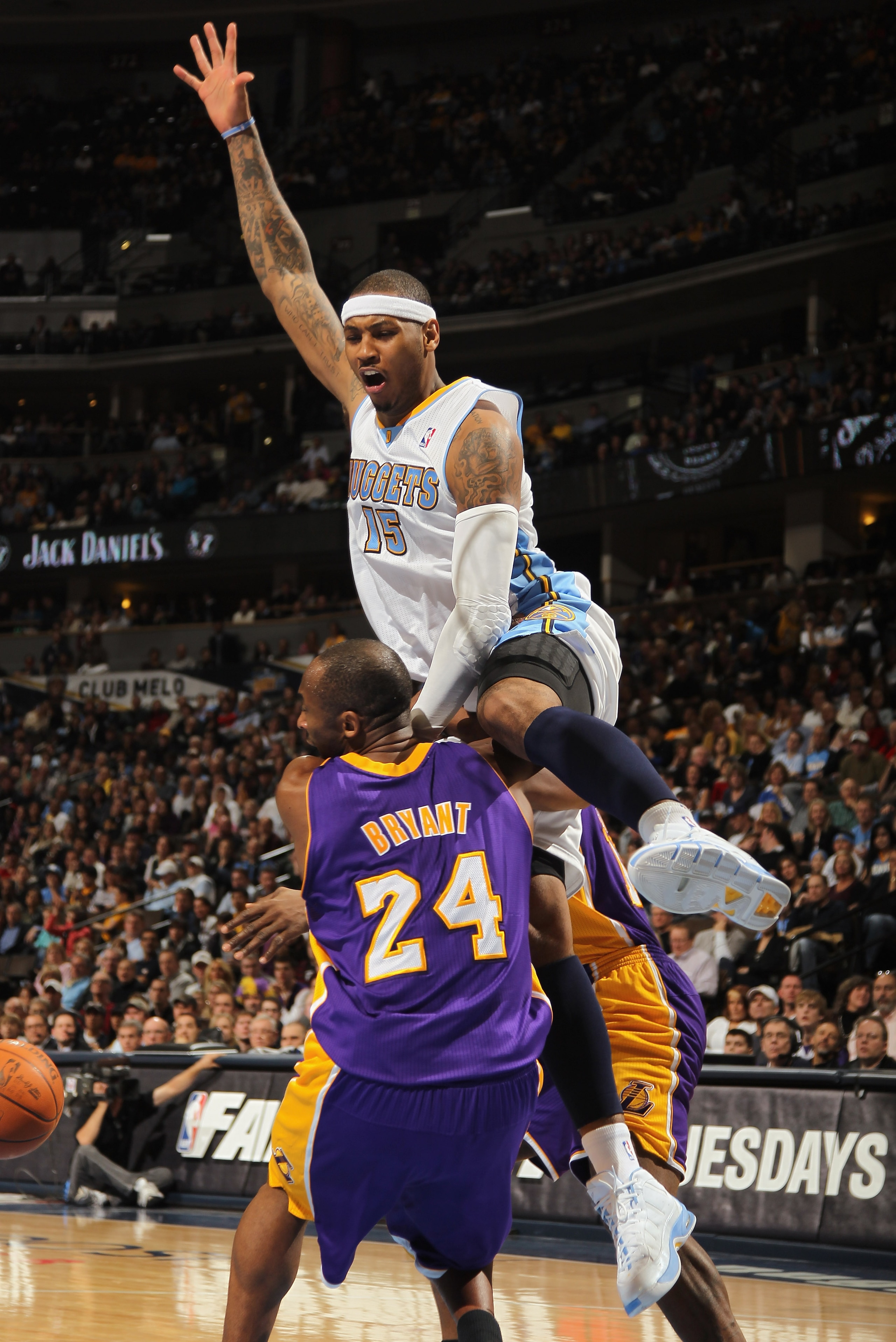 DENVER, CO - JANUARY 21:  Carmelo Anthony #15 of the Denver Nuggets collides with Kobe Bryant #24 of the Los Angeles Lakers at the Pepsi Center on January 21, 2011 in Denver, Colorado. The Lakers defeated the Nuggets 107-97. NOTE TO USER: User expressly a