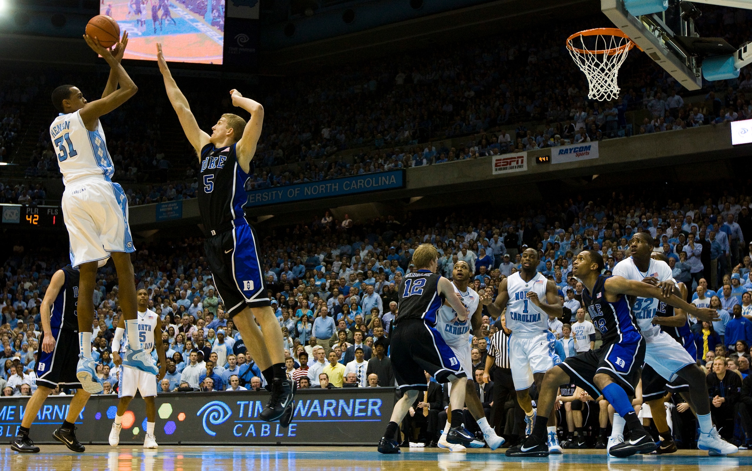 CHAPEL HILL, NC - FEBRUARY 10: North Carolina forward John Henson #31 shoots over Duke forward Mason Plumlee #5 during a men's college basketball game at Dean Smith Center on February 10, 2010 in Chapel Hill, North Carolina. (Photo by Chris Keane/Getty Im