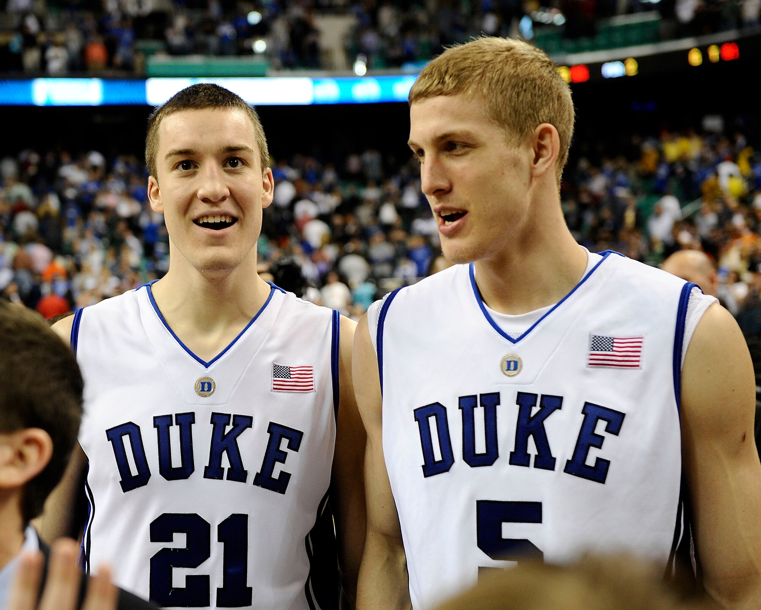 GREENSBORO, NC - MARCH 14:  Miles Plumlee #21 and Mason Plumlee #5 of the Duke Blue Devils smile after win over the Georgia Tech Yellow Jackets in the championship game of the 2010 ACC Men's Basketball Tournament at the Greensboro Coliseum on March 14, 20