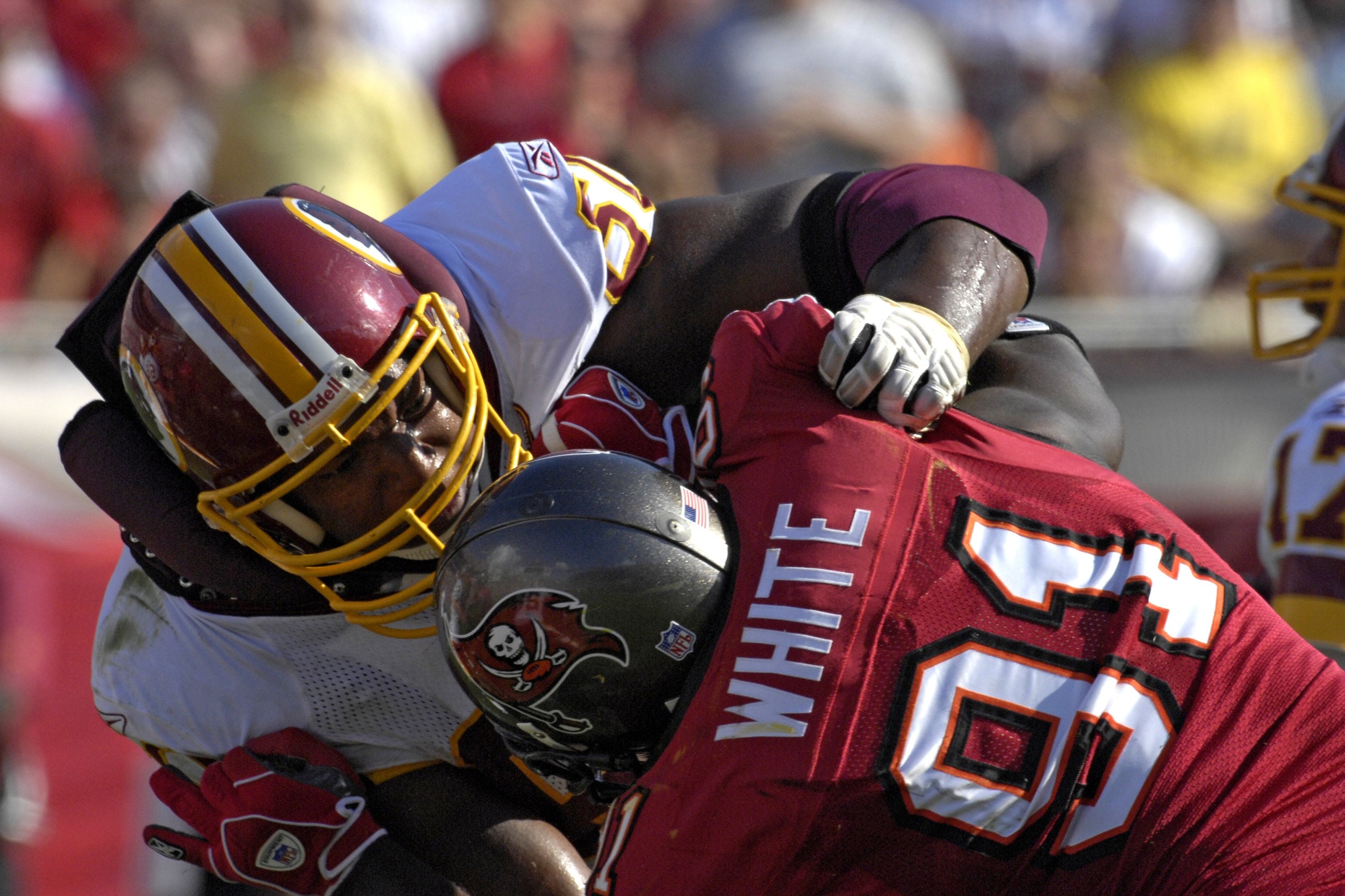 TAMPA, FL - NOVEMBER 25: Tackle Chris Samuels #60 of the Washington Redskins blocks against defensive end Greg White #91 the Tampa Bay Buccaneers at the Raymond James Stadium on November 25, 2007 in Tampa, Florida.  The Bucs won 19-13. (Photo by Al Messer