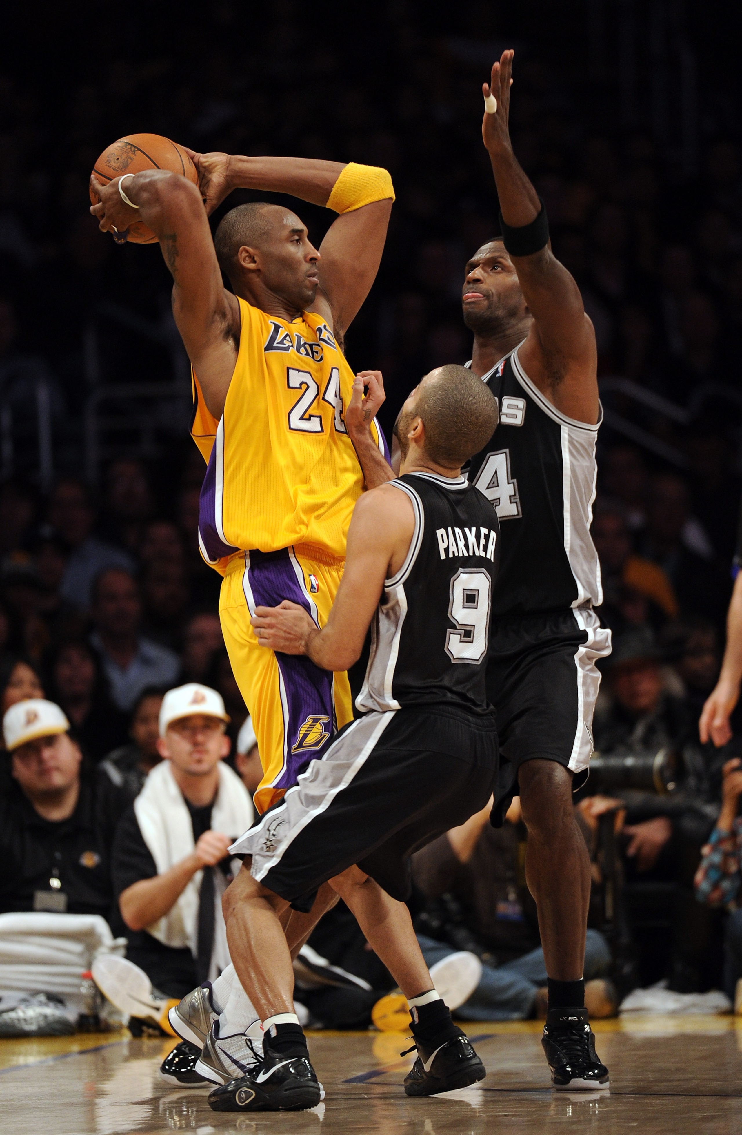 LOS ANGELES, CA - FEBRUARY 03:  Kobe Bryant #24 of the Lakers is surrounded by Antonio McDyess #34 and Tony Parker #9 of the San Antonio Spurs Los Angeles during an 89-88 Spur win at Staples Center on February 3, 2011 in Los Angeles, California.  NOTE TO
