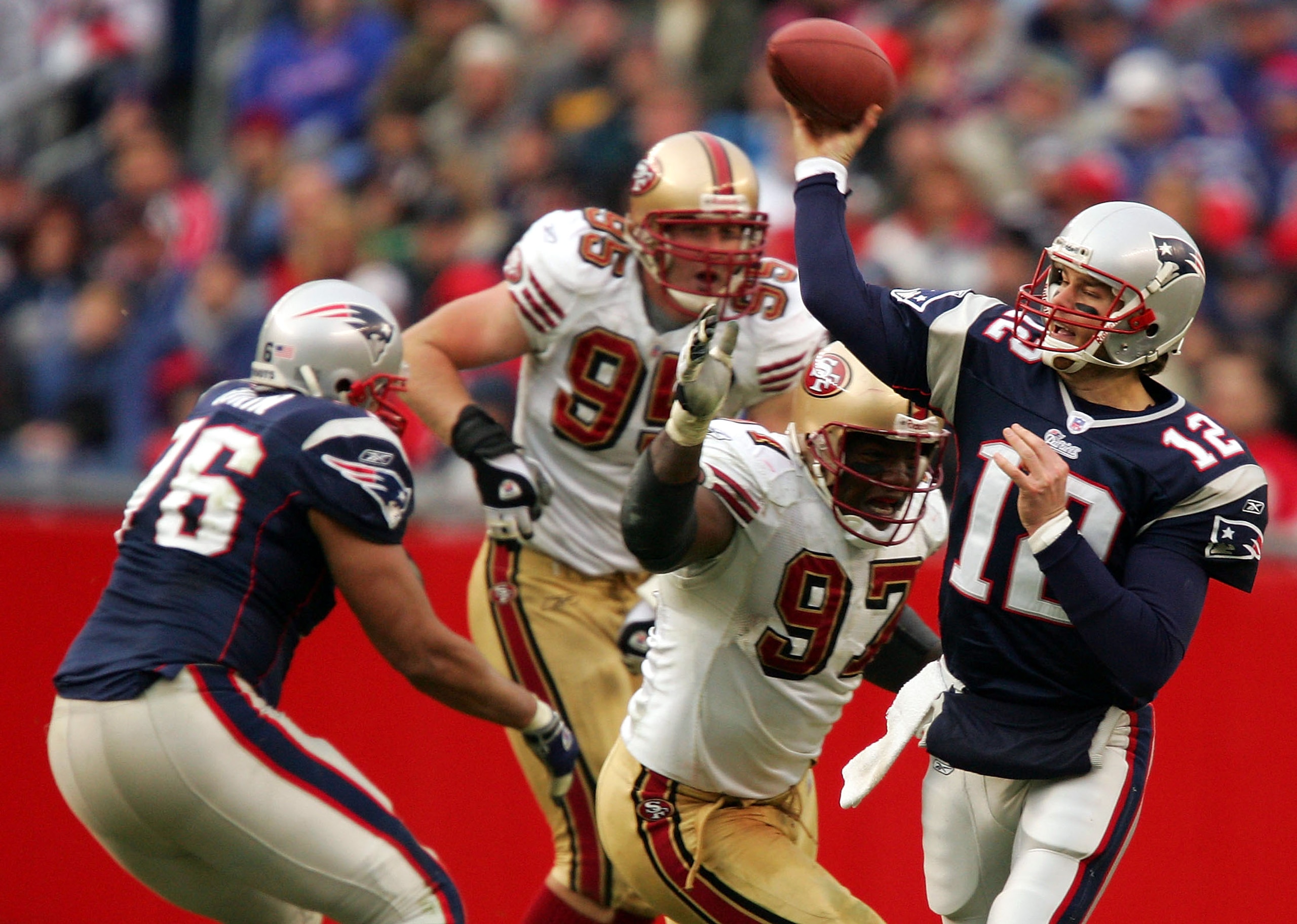 FOXBORO, MA - JANUARY 2:  Tom Brady #12 of the New England Patriots passes against the San Francisco 49ers during their game on January 2, 2005 at Gillette Stadium in Foxboro, Massachusetts. (Photo by Al Bello/Getty Images)