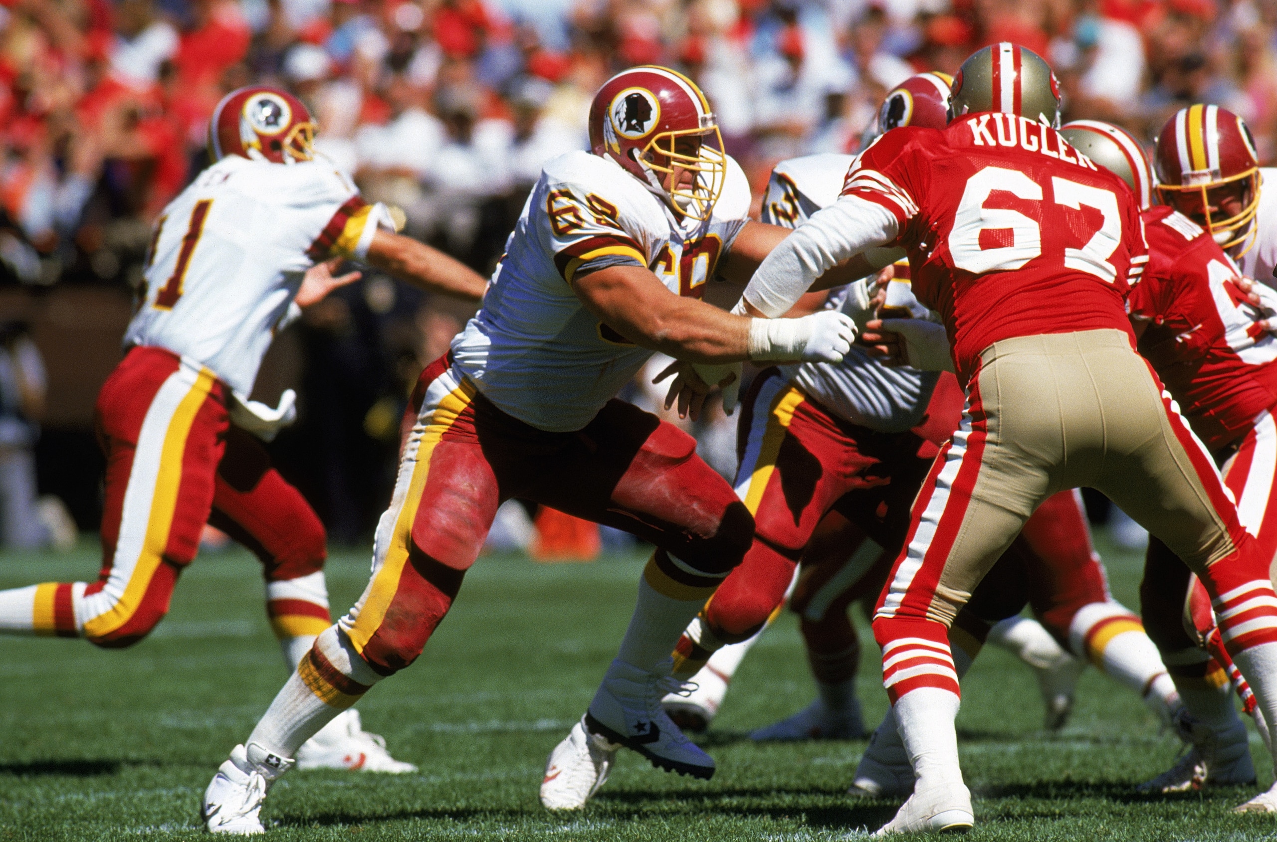 SAN FRANCISCO - SEPTEMBER 16:  Offensive linebacker Russ Grimm #68 of the Washington Redskins holds off San Francisco 49ers defense during a game at Candlestick Park on September 16, 1990 in San Francisco, California. (Photo by Otto Greule Jr/Getty Images