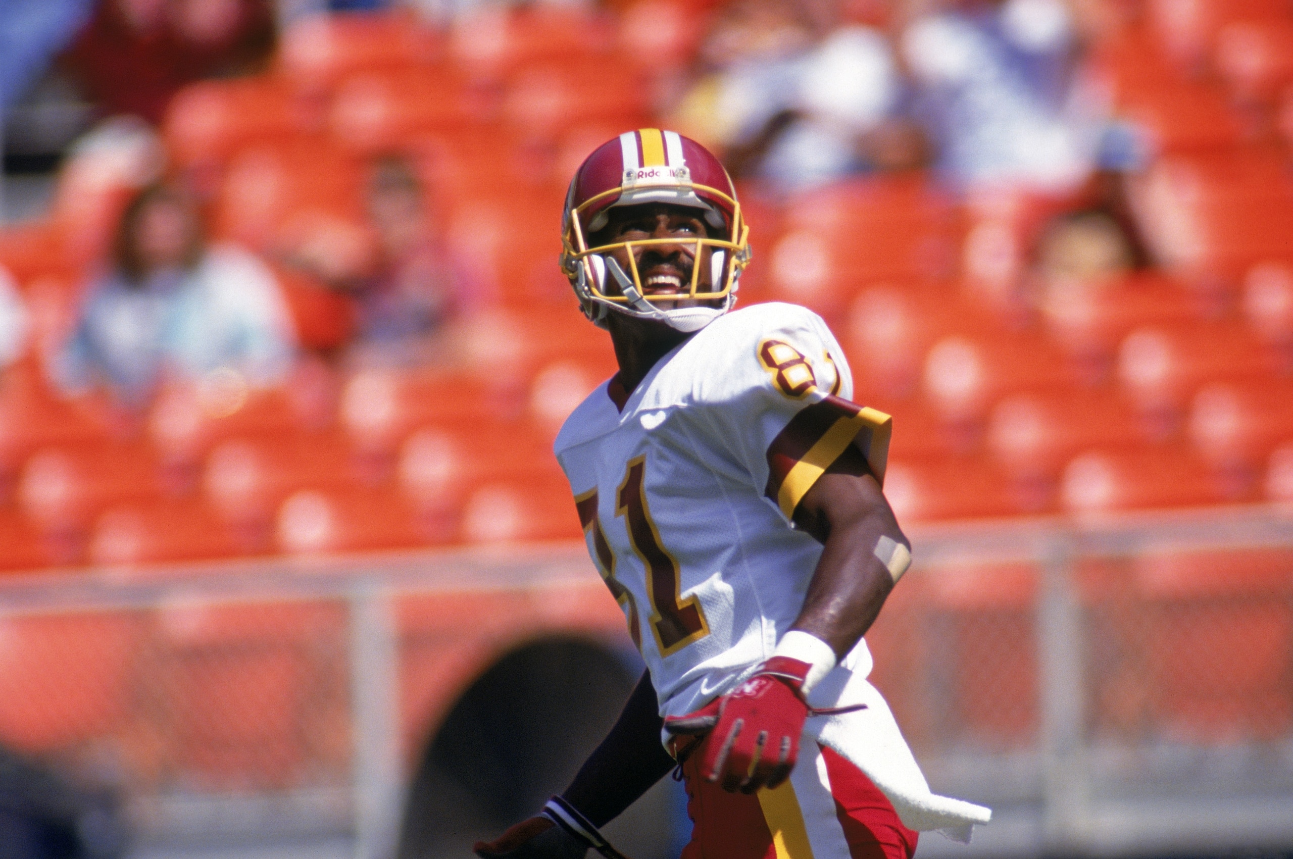 WASHINGTON, DC - SEPTEMBER 13:  Wide receiver Art Monk #81 of the Washington Redskins runs as he watches the flight of the ball during a game against the Atlanta Falcons at RFK Memorial Stadium on September 13, 1992 in Washington, D.C.  The Redskins defea