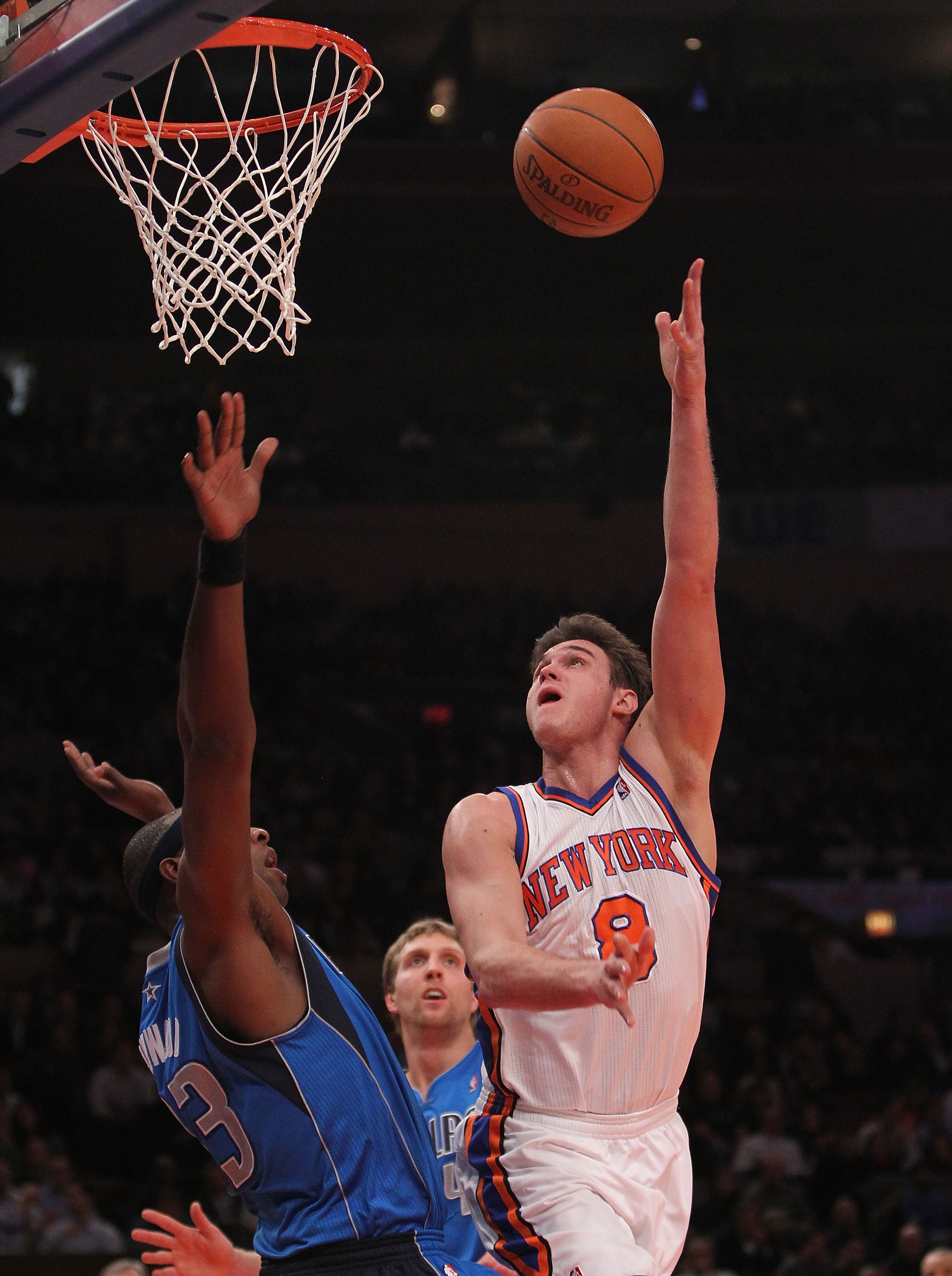 NEW YORK, NY - FEBRUARY 02:  Danilo Gallinari #8 of the New York Knicks shoots the ball over Brendan Haywood #33 of the Dallas Mavericks at Madison Square Garden on February 2, 2011 in New York City. NOTE TO USER: User expressly acknowledges and agrees th