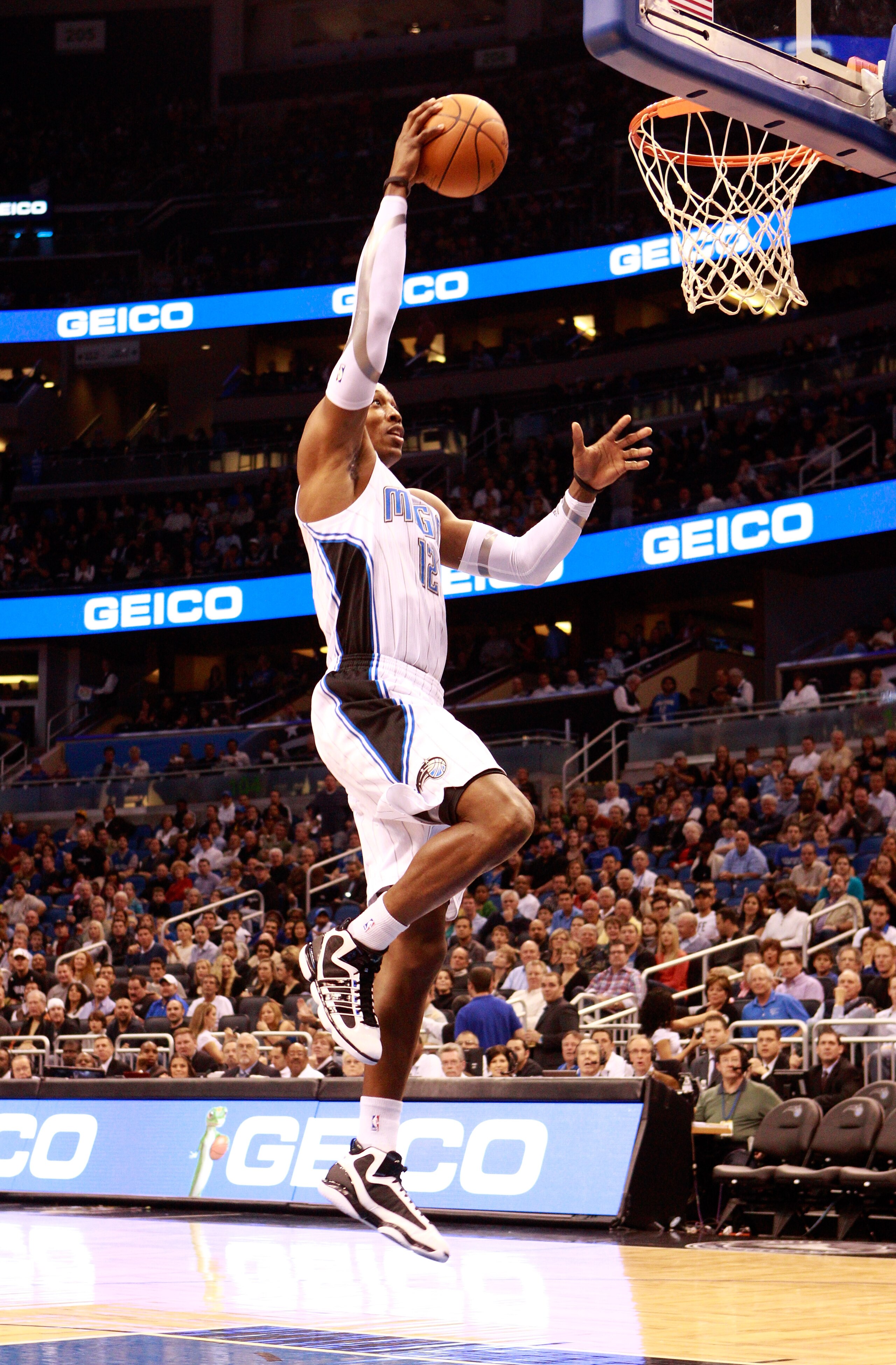 ORLANDO, FL - JANUARY 24: Dwight Howard #12 of the Orlando Magic attempts a shot during the game against the Detroit Pistons at Amway Arena on January 24, 2011 in Orlando, Florida. NOTE TO USER: User expressly acknowledges and agrees that, by downloadin ORLANDO, FL - JANUARY 24: Dwight Howard #12 of the Orlando Magic attempts a shot during the game against the Detroit Pistons at Amway Arena on January 24, 2011 in Orlando, Florida. NOTE TO USER: User expressly acknowledges and agrees that, by downloadin