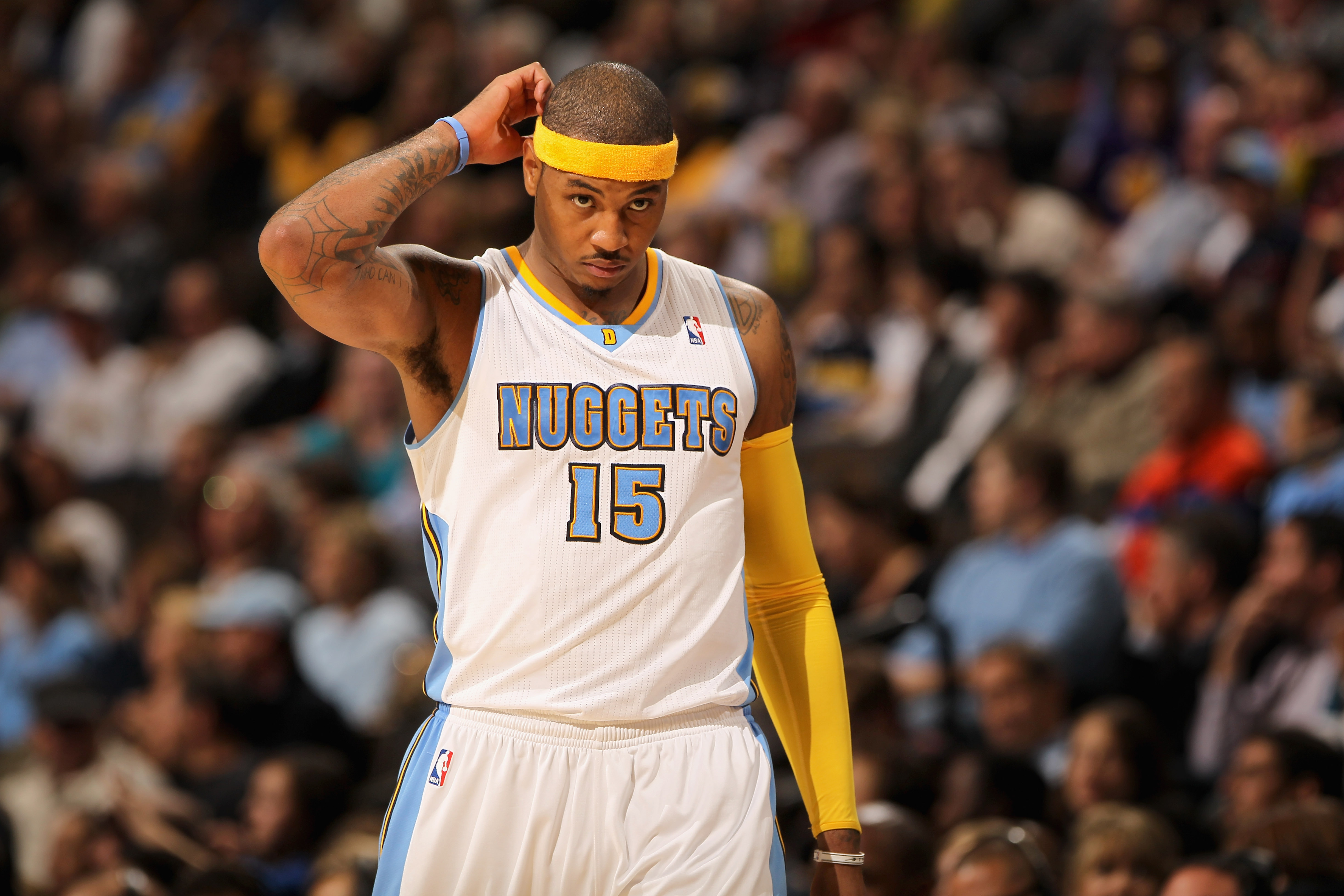 DENVER - NOVEMBER 11:  Carmelo Anthony #15 of the Denver Nuggets looks on during a break in the action against the Los Angeles Lakers at the Pepsi Center on November 11, 2010 in Denver, Colorado. The Nuggets defeated the Lakers 118-112.  NOTE TO USER: Use
