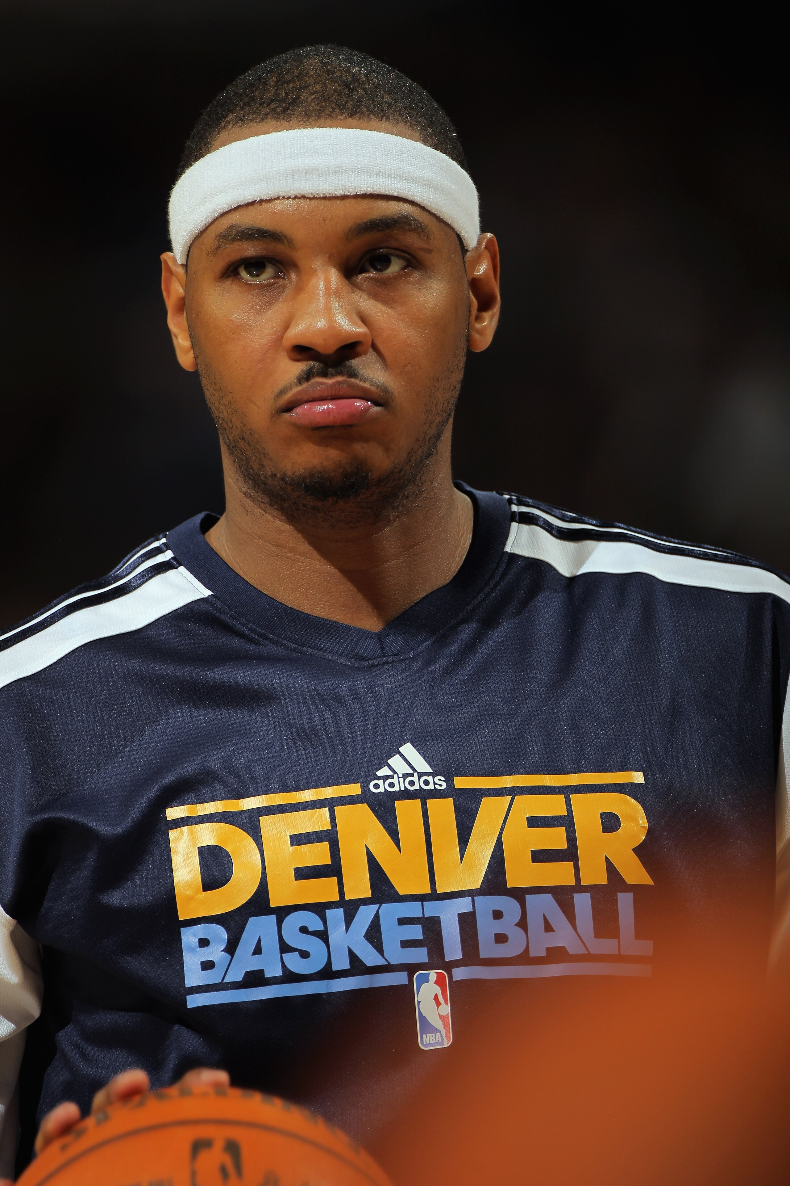 DENVER, CO - JANUARY 21: Carmelo Anthony #15 of the Denver Nuggets looks on as he warms up for the second half against the Los Angeles Lakers at the Pepsi Center on January 21, 2011 in Denver, Colorado. The Lakers defeated the Nuggets 107-97. NOTE TO USE DENVER, CO - JANUARY 21: Carmelo Anthony #15 of the Denver Nuggets looks on as he warms up for the second half against the Los Angeles Lakers at the Pepsi Center on January 21, 2011 in Denver, Colorado. The Lakers defeated the Nuggets 107-97. NOTE TO USE