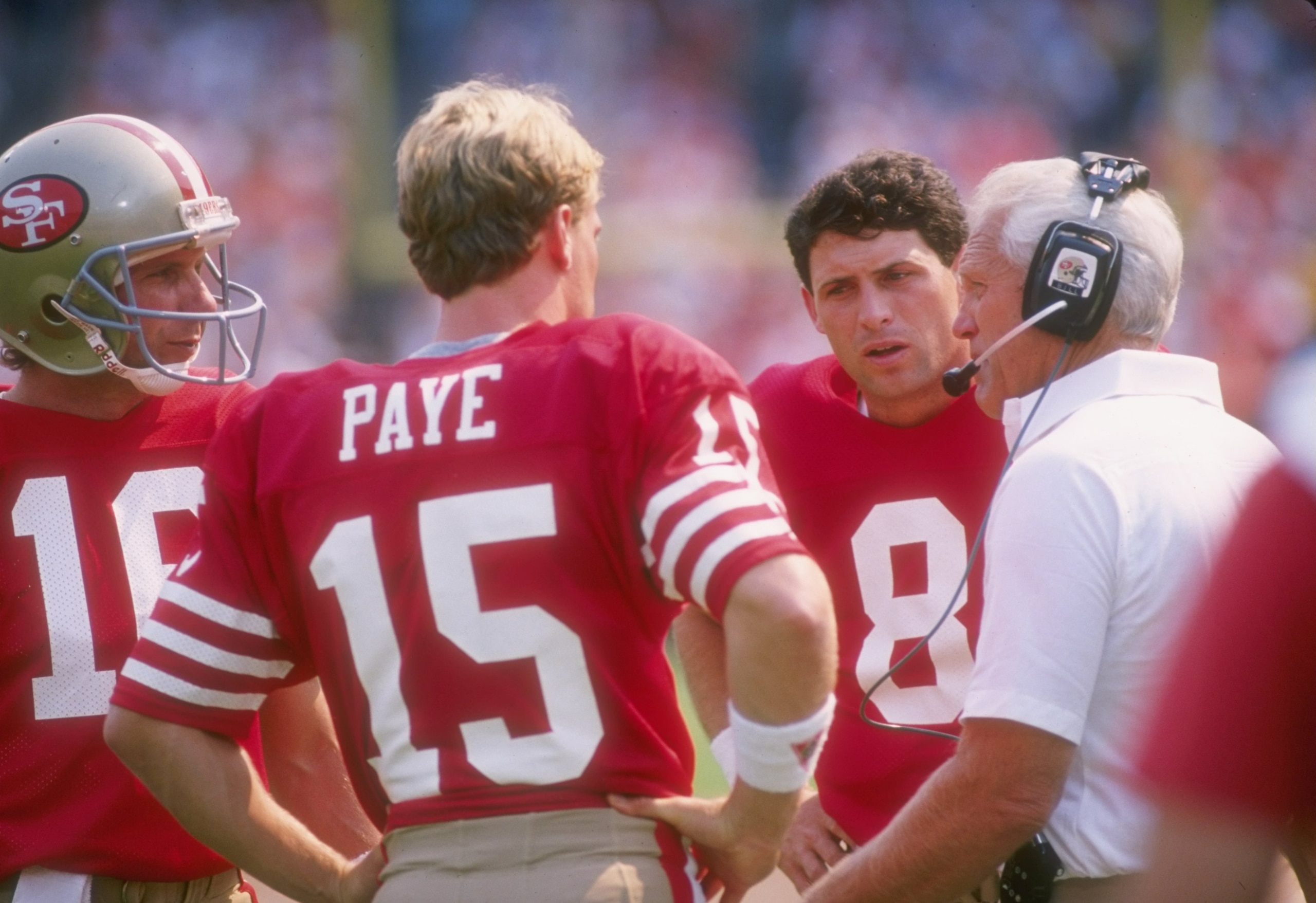 18 Sep 1988:  San Francisco 49ers head coach Bill Walsh confers with quarterbacks Joe Montana, John Paye, and Steve Young (l to r) during a game against the Atlanta Falcons at Candlestick Park in San Francisco, California.  The Falcons won the game, 34-17
