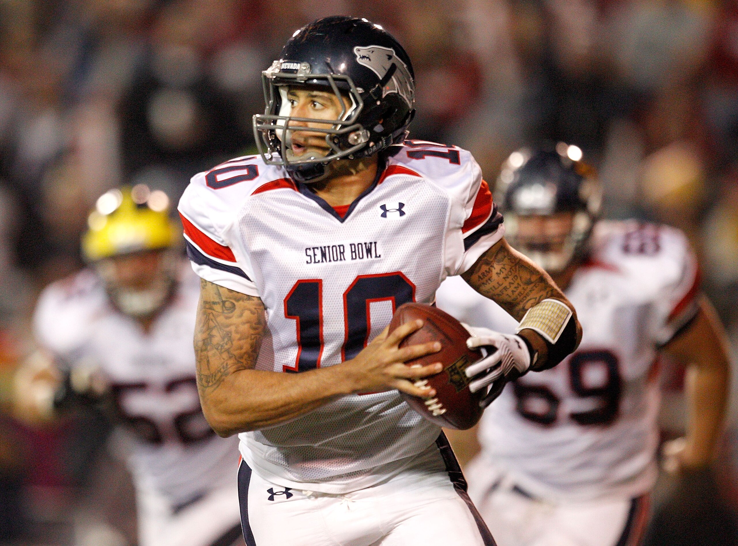MOBILE, AL - JANUARY 29: Quarterback Jake Locker #10 of the North Team scrambles out of the pocket while taking on the South Team during the fourth quarter of the Under Armour Senior Bowl on January 29, 2011 at Ladd-Pebbles Stadium in Mobile, Alabama.  (P