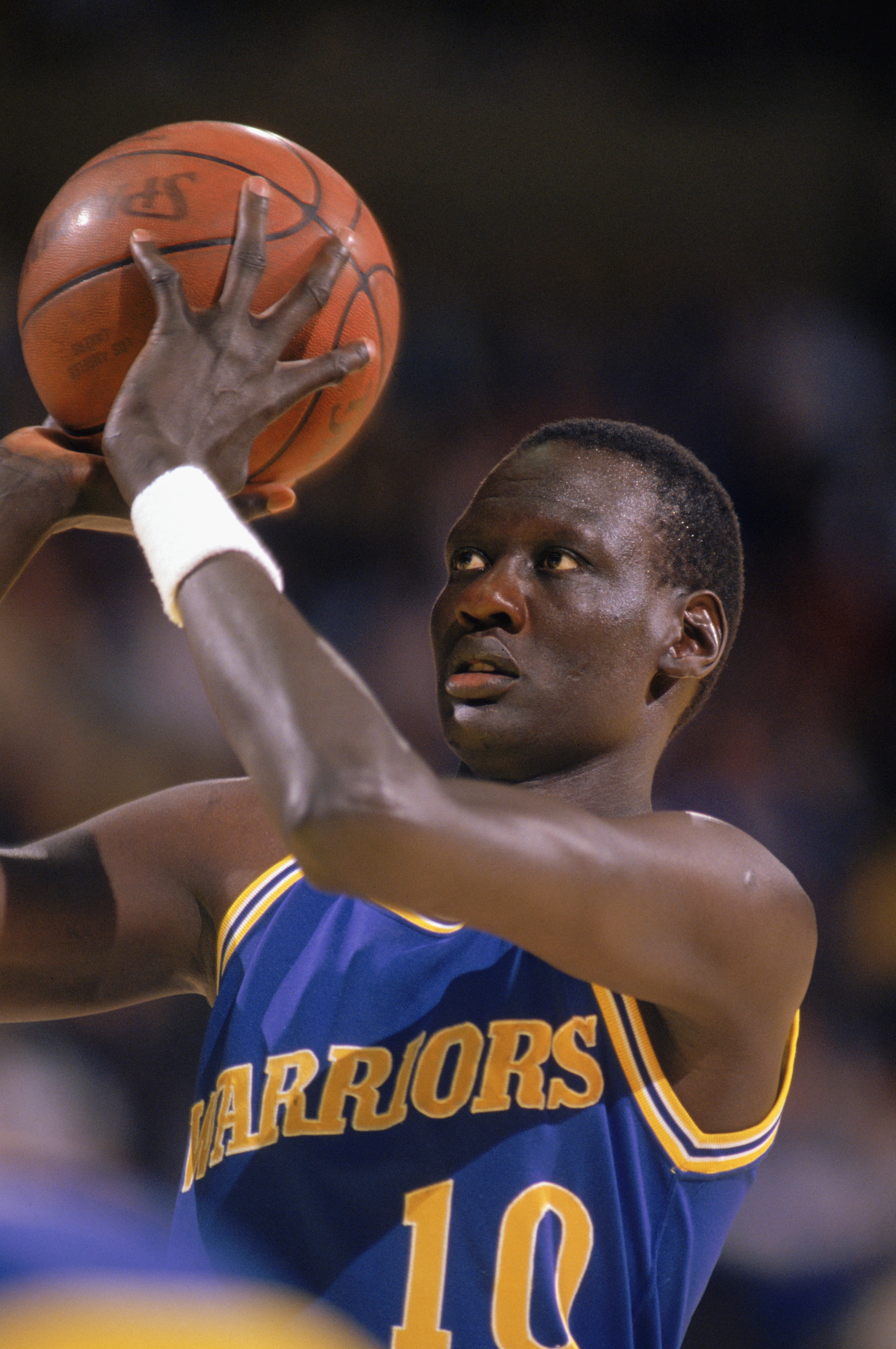 1988:  Manute Bol #10 of the Golden State Warriors looks to shoot during an NBA game in the 1988-89 season. NOTE TO USER: User expressly acknowledges and agrees that, by downloading and/or using this Photograph, User is consenting to the terms and conditi