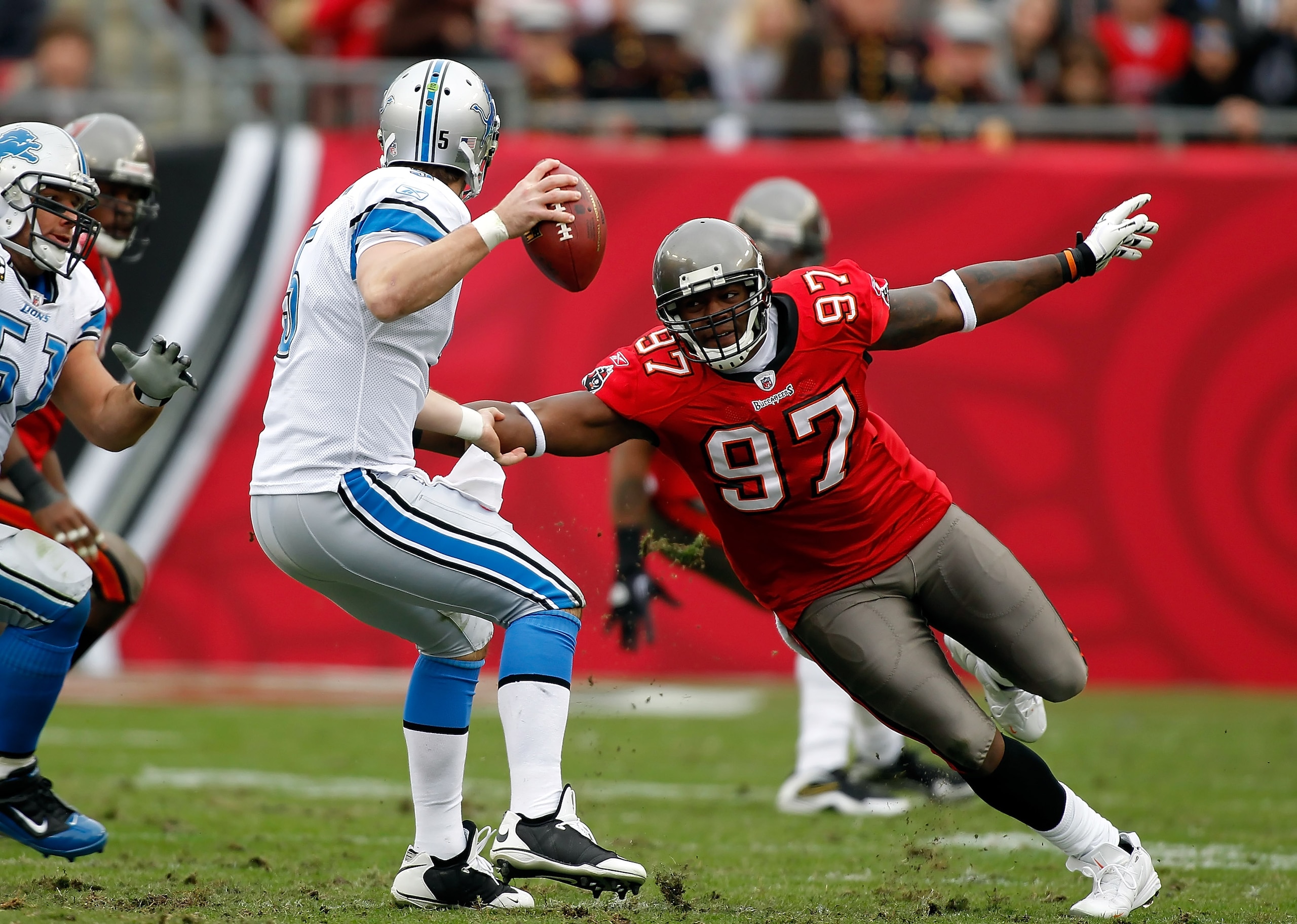 TAMPA, FL - DECEMBER 19: Defensive end Alex Magee #97 of the Tampa Bay Buccaneers closes in on quarterback Drew Stanton #5 of the Detroit Lions during the game at Raymond James Stadium on December 19, 2010 in Tampa, Florida. (Photo by J. Meric/Getty Ima TAMPA, FL - DECEMBER 19: Defensive end Alex Magee #97 of the Tampa Bay Buccaneers closes in on quarterback Drew Stanton #5 of the Detroit Lions during the game at Raymond James Stadium on December 19, 2010 in Tampa, Florida. (Photo by J. Meric/Getty Ima