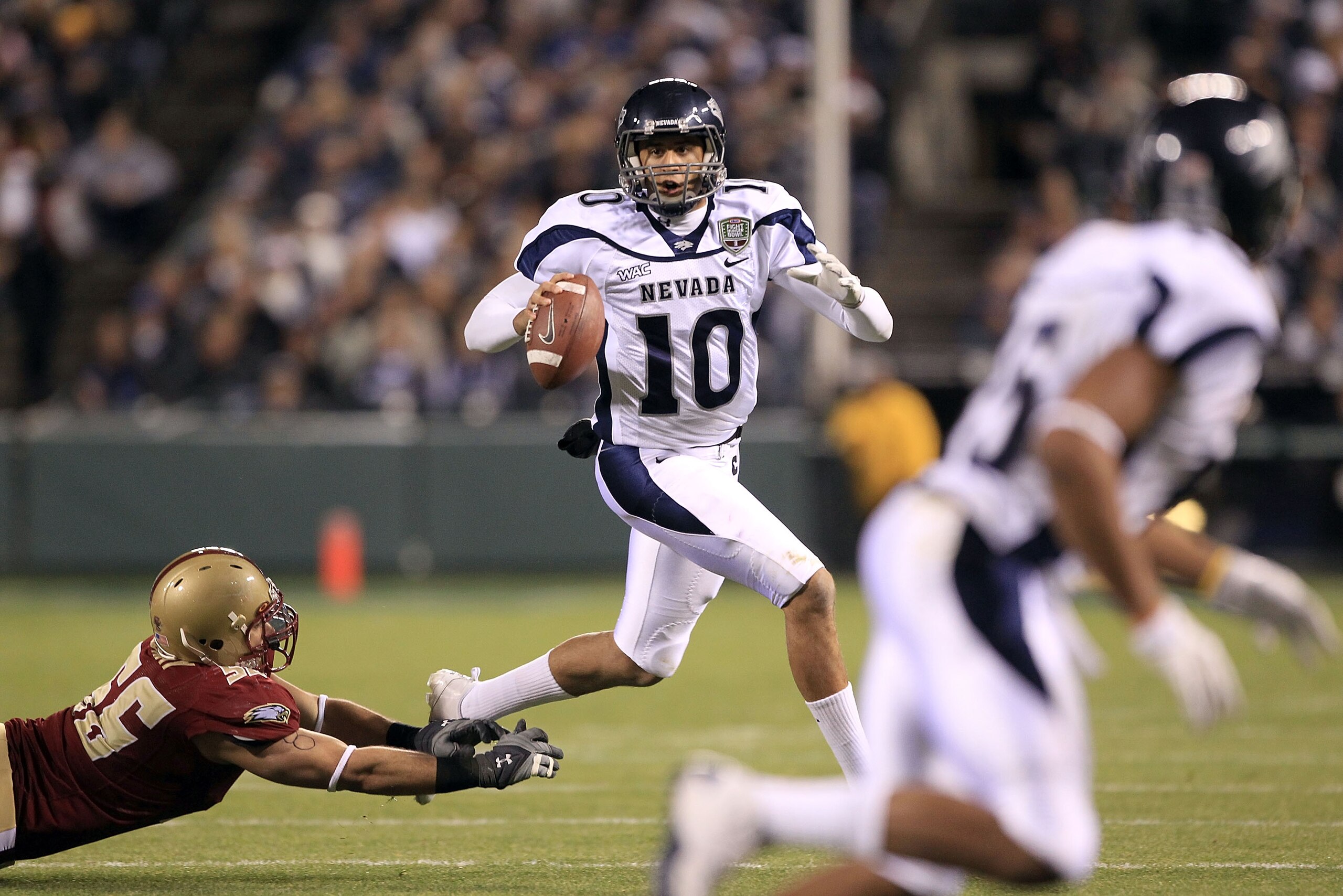 SAN FRANCISCO, CA - JANUARY 09: Colin Kaepernick #10 of the Nevada Wolf Pack looks to pass the ball against Boston College during the Kraft Fight Hunger Bowl at AT&T Park on January 9, 2011 in San Francisco, California. (Photo by Ezra Shaw/Getty Images) SAN FRANCISCO, CA - JANUARY 09: Colin Kaepernick #10 of the Nevada Wolf Pack looks to pass the ball against Boston College during the Kraft Fight Hunger Bowl at AT&T Park on January 9, 2011 in San Francisco, California. (Photo by Ezra Shaw/Getty Images)