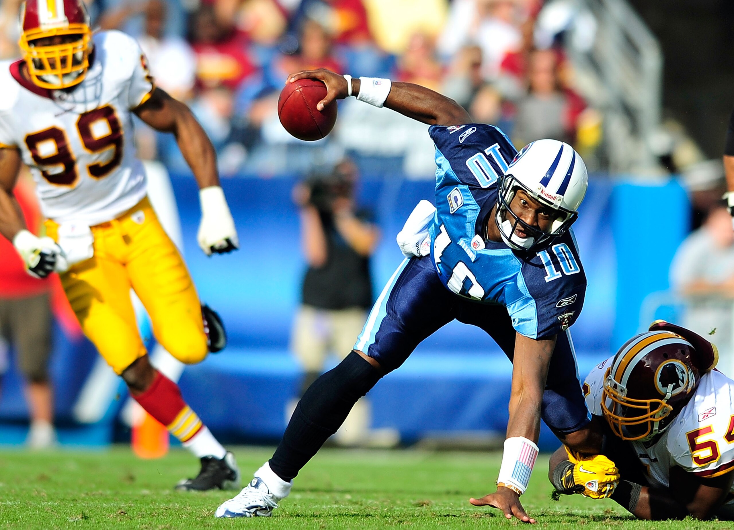 NASHVILLE, TN - NOVEMBER 21: Quarterback Vince Young #10 of the Tennessee Titans scrambles away from H.B. Blades #54 of the Washington Redskins at LP Field on November 21, 2010 in Nashville, Tennessee. The Redskins won 19-16 in overtime. (Photo by Grant NASHVILLE, TN - NOVEMBER 21: Quarterback Vince Young #10 of the Tennessee Titans scrambles away from H.B. Blades #54 of the Washington Redskins at LP Field on November 21, 2010 in Nashville, Tennessee. The Redskins won 19-16 in overtime. (Photo by Grant